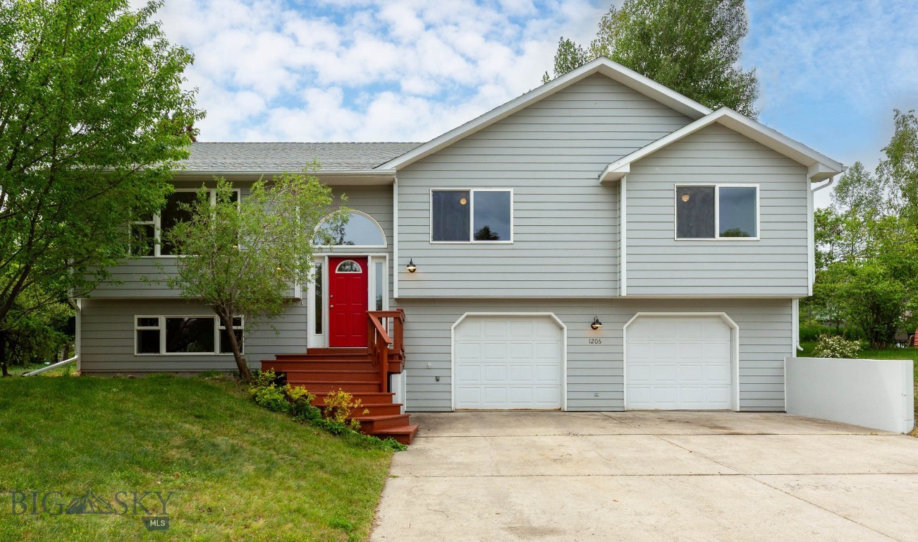 Experience the best of Bozeman living in this move-in ready home perfectly positioned along open space with direct trail access. Step outside to miles of hiking, biking, and cross-country ski routes, with Bozeman Deaconess Hospital, Montana State University, grocery stores, coffee shops, and downtown just minutes away.

Inside, an open-concept living area welcomes you with vaulted ceilings, abundant natural light, and seamless flow to the deck and fenced backyard, Warm hardwood oak floors ground the main level, complemented by a gas forced-air furnace with AC for year-round comfort.

The private primary suite features a walk-in closet, blackout blinds, and a full ensuite bath. Main-level laundry adds everyday convenience. Downstairs, a flexible extra room with its own ensuite bath adapts to your life—set it up as a family room, home gym, guest space, or office.

Practical perks include an oversized two-car garage for gear and toys, extra storage in the basement, and a premier location that puts trailheads, schools, healthcare, and everyday essentials right at your doorstep.