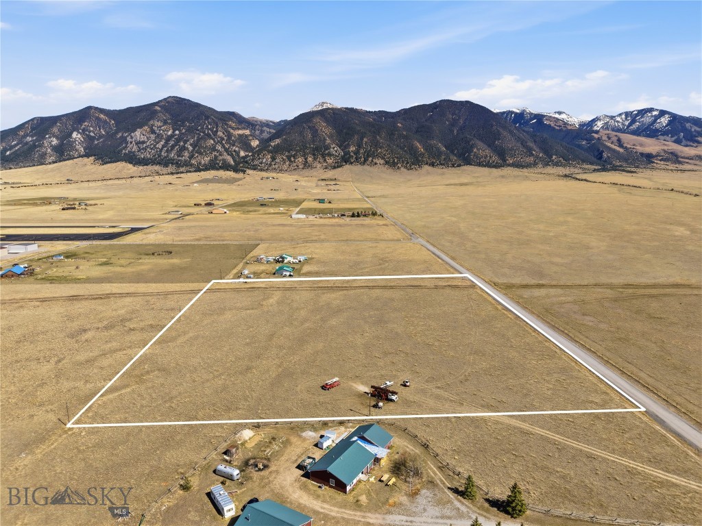 Welcome to your slice of Montana paradise—located in a unique airpark subdivision just minutes from the charming town of Ennis. Set against breathtaking mountain views, this property is perfect for outdoor enthusiasts and aviators alike. Ennis, known for its small-town charm and vibrant fishing culture, is a gateway to world-class fly fishing on the Madison River. Nearby attractions include the premier ski resort of Big Sky and the wonders of Yellowstone National Park, both just a scenic drive away. Whether you're seeking adventure or tranquility, this property delivers a lifestyle unlike any other—where freedom, nature, and convenience converge. Seller is a Licensed Montana Real Estate Agent. Property has a new Well!