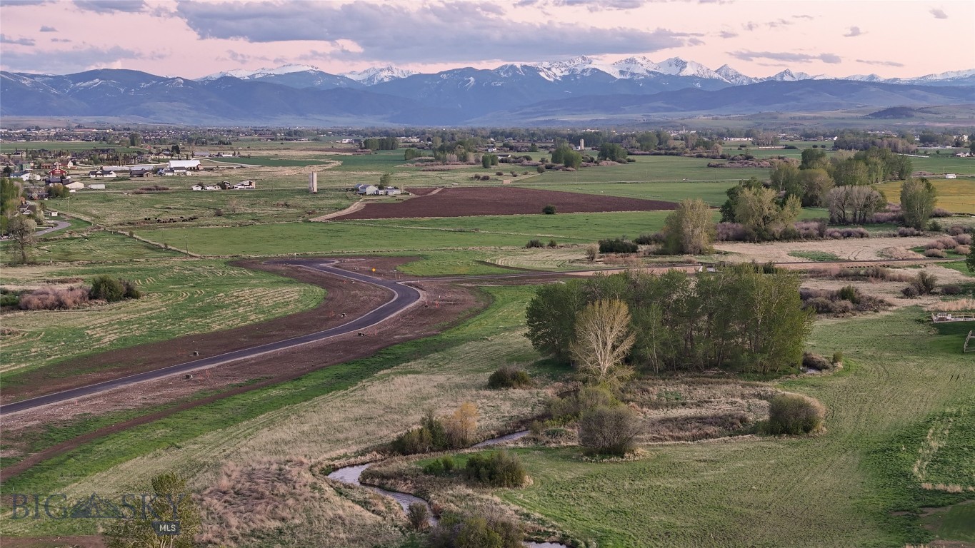 Just under an acre lot in the stunning Riverwood Subdivision! Nestled between Bozeman & Belgrade with a Bozeman address, this subdivision
offers a rural feel while being close to all of the area amenities. Boasting a variety of views: mountains, farmland, rural, and even a creek running
through the property. This is a great opportunity for those seeking elbow room and privacy while also being minutes away from town. Get going on
your dream home today!