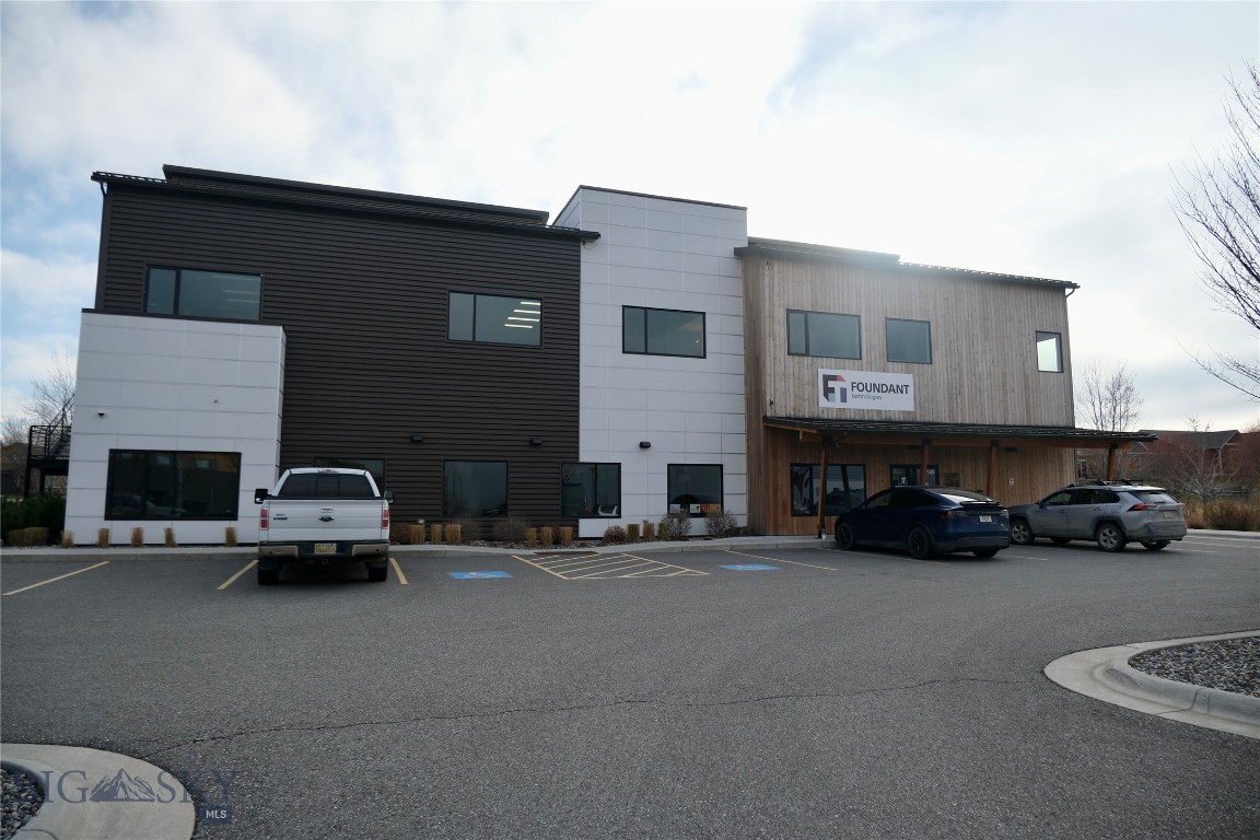 Wonderful modern office building just west of Bozeman in the growing Woodland Park subdivision. This is the ground floor of a two floor office building. The first floor has three private offices, and two board rooms. There are multiple built in work stations throughout the rest of the space. Nice break area with kitchenette and patio, and a reception desk.