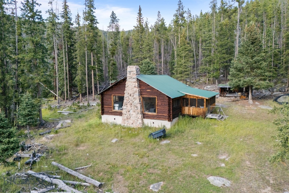 If your dream is to live deep in the heart of the forest, surrounded by nature and absolute privacy, this is the property for you. Nestled at the end of the road, 220 High Valley Road offers 35.57 acres of untouched beauty bordered on three sides by U.S. Forest Service land, ensuring protection, seclusion, and endless opportunities to explore. A year-round raging creek runs through the property, providing both an incredible natural feature and the soothing sound of rushing water. Wildlife thrives here—elk, deer, and other mountain creatures roam freely across the land, offering a true wilderness experience. The property also includes a rustic one-bedroom cabin, ideal as a hunting retreat, weekend escape, or base camp. While it does not have a well or septic system, it provides a footprint for future use and the charm of authentic mountain living. Whether you’re seeking a private sanctuary, a recreational getaway, or the perfect spot to build your dream home in the forest, this property offers serenity at its finest.