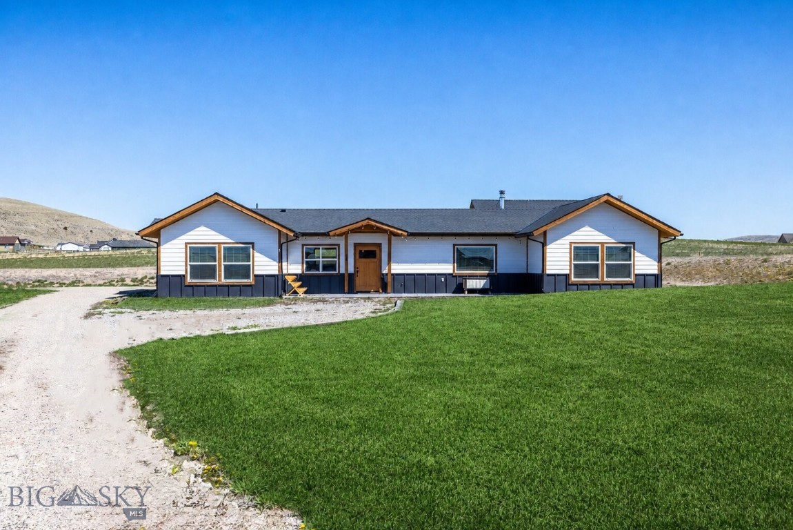 Set on an expansive 1.48-acre parcel in the Village at Elk Ridge, this thoughtfully designed single-level home offers space, comfort, and sweeping Montana views. With 2,041 square feet, 3 bedrooms, and 2 bathrooms, the home combines clean design with quality craftsmanship and functional living.

The heart of the home is a beautifully appointed kitchen featuring custom cabinetry, generous workspace, and a seamless flow into the open living and dining areas, ideal for both everyday living and entertaining. The primary suite is equally well executed, with a spacious layout and a well-finished bathroom designed for comfort and ease.

A wood stove anchors the living space, adding warmth and character while providing an efficient secondary heat source, perfect for Montana winters. The single-level floor plan enhances livability, with a practical layout that separates the primary suite from the guest bedrooms.

Outside, the larger-than-average 1.48-acre lot offers privacy, elbow room, and opportunity. Whether you're looking to add a shop, create additional outdoor living space, or simply enjoy the open setting, the property provides flexibility that is increasingly hard to find in this price point.

Additional features include a 2-car attached garage, private well and septic, and paved access, all located just under 30 miles from Bozeman Yellowstone International Airport .

This is a well-built, thoughtfully designed home that captures the essence of Montana living, space, views, and quality construction in a quiet Three Forks setting.  Custom built cabinetry by Corbett Carpentry. Waffle grid/5-6" slab foundation.  Whole house water softener, and reverse osmosis water system at the kitchen sink.  On demand hot water heater, 400 amp service with space for 200 amp shop to be added.