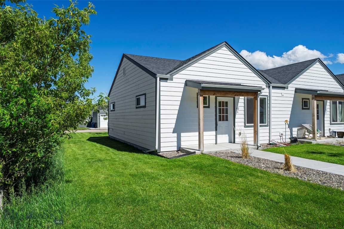 Welcome to your perfect Montana retreat in the heart of Livingston. This beautifully maintained end-unit condo offers 2 bedrooms, 1 bathroom, and 704 sq. ft. of thoughtfully designed single-level living with comfort and modern style throughout. Lightly lived in by one owner and never used as a rental, this home shows and feels like new, featuring fresh interior paint and brand-new carpet. Set in a peaceful neighborhood with stunning mountain views, this property offers an ideal blend of tranquility and convenience. The bright, open floor plan features vaulted ceilings, durable LVT flooring, sleek black appliances, and a stylish tiled backsplash. The newly carpeted bedrooms provide a cozy and restful retreat, while the detached one-car garage offers convenient storage for vehicles and outdoor gear. Enjoy an unbeatable location just minutes from downtown Livingston's restaurants, art galleries, and vibrant local culture, approximately 5 minutes from Livingston HealthCare, and less than a mile from the iconic Yellowstone River. You're also just 30 minutes from Bozeman and within easy reach of Yellowstone National Park. Whether you're seeking a primary residence, weekend getaway, or investment opportunity, this low-maintenance condo delivers Montana living at its finest. Schedule your showing today and experience all this exceptional home has to offer.
