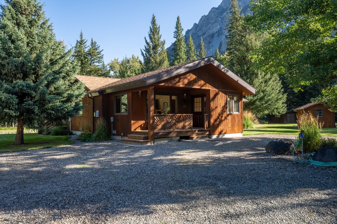 Nestled among the pines in a peaceful mountain setting, this immaculate cedar-sided home offers the perfect Montana retreat just steps from the National Forest Service and the renowned Boulder River. Whether you are looking for a cozy family cabin or comfortable year-round living, this turnkey property is ready to enjoy from day one.

The charming 3-bedroom, 1-bath main home features warm rustic touches throughout, including a stunning river rock gas fireplace and an additional gas stove for added comfort. Heated tile floors in both the kitchen and bath create a welcoming touch during every season. The inviting screened-in porch with a built-in BBQ is the ideal place to relax, entertain, and take in the tranquil surroundings.

Outside, the lush lawn is maintained with underground sprinklers, while the garage and oversized shop provide ample space for vehicles, storage, and hobbies.

Guests and family will appreciate the separate apartment offering 2 bedrooms, 1 1/2 bath, a kitchenette, and a covered deck perfectly positioned for enjoying mountain views and abundant wildlife, including frequent moose sightings. The guest apartment is handicapped accessible.

Located just 45 minutes south of Big Timber, Montana, this exceptional property combines seclusion and convenience, with both Billings and Bozeman airports within a two-hour drive. A rare opportunity to own a private mountain getaway with recreation, fishing, hiking, and nature right outside your door.