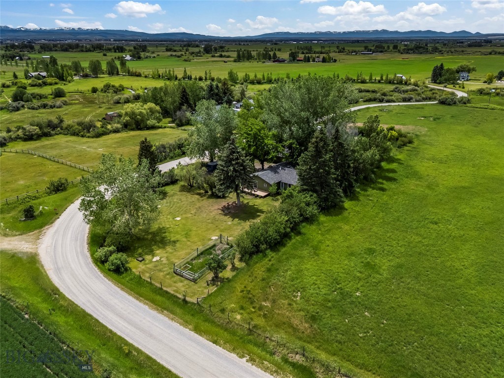 Price Adjustment!
Dreaming of a country home just minutes from both Belgrade and Bozeman? This unique 2-acre property North of town off of Springhill Road offers space, flexibility, and Montana lifestyle at its finest. Featuring a 2,320± sq. ft. home, this property includes two separate 1-acre parcels, providing incredible opportunity for future expansion, investment, multi-generational living or a remodeling project.

Enjoy a peaceful setting surrounded by farmland and mature trees, and just down the road from the East Gallatin River, known for some of the area’s best fly fishing. Whether you're looking to create your own private sanctuary or build a second home on the additional lot, the possibilities here are truly endless.

The property is ideal for those seeking a hobby farm or self-sufficient lifestyle, with room for chickens, goats, and expansive garden space. What a great property for market gardens! While open skies and quiet surroundings offer a relaxed, rural feel.

The existing home features 3 bedrooms, 2 bath along with a 2-car garage and additional shop space (being used for horse barn) perfect for storage, projects, or equipment.

No covenants, strong rental potential, and long-term value make this a rare and versatile offering. More space, more freedom, more opportunity to create the lifestyle you’ve been looking for.