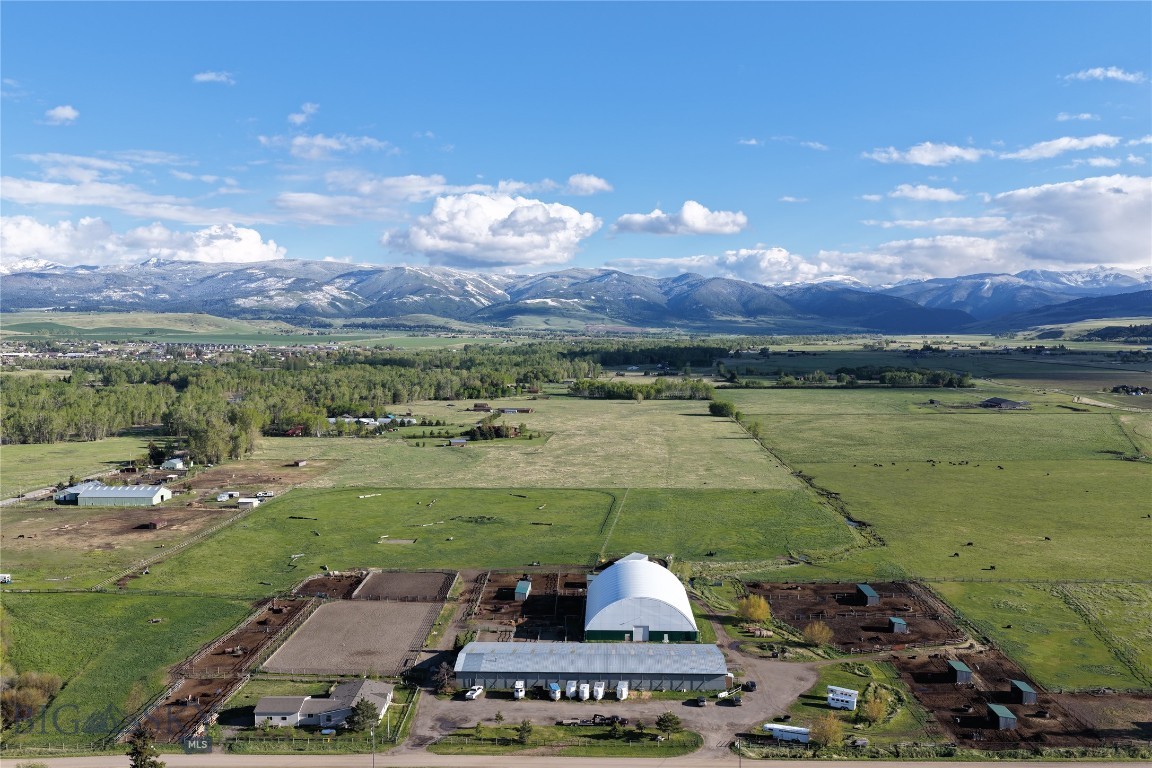 Located twelve miles from downtown Bozeman, this rare ±30-acre horse property offers an ideal lifestyle and premier facilities for equine enthusiasts. At the heart of the property is a comfortable 3-bedroom, 2-bath home featuring a south-facing porch, wood stove, hot tub, and greenhouse, all set against sweeping views of the Spanish Peaks.

Designed for year-round use, the property includes two indoor arenas, a large outdoor arena, a cutting pen, a round pen, cow-working facilities, irrigated pastures, and extensive paddock systems with shelters and automatic waterers. The main barn is equipped with 14 stalls, tack rooms, a wash stall, a heated lounge, vet and shoeing areas, an employee studio apartment, and ample storage.

More than just a residence, this is a thriving equestrian property capable of boarding up to 50 horses. The property boasts an established boarding business with an outstanding reputation, a consistent waitlist, experienced barn management, and knowledgeable resident trainers already in place.

With excellent water rights and extensive irrigation infrastructure, keeping the grass growing will be a breeze. Included equipment such as a tractor and skid steer will make the daily operations efficient and turnkey. This is a unique opportunity to acquire a fully functioning equestrian facility ideally situated between downtown Bozeman and Big Sky, Montana.