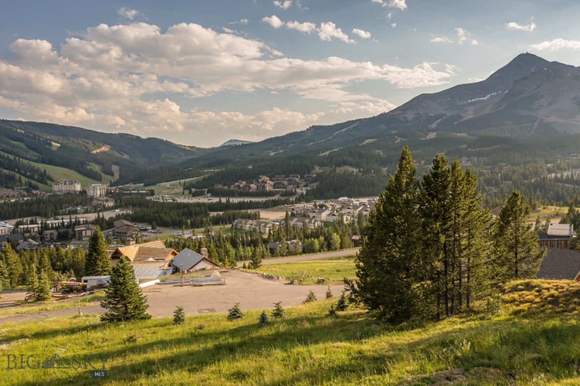 Nestled in the heart of Big Sky, Montana, this exceptional homesite captures breathtaking views of Lone Peak and the surrounding mountain landscape. Ideally positioned for premier mountain views and access to world-class skiing, hiking, and biking, this property offers the perfect setting to build your dream mountain retreat.

Spanning over one acre, Washakie Homesite 23 provides ample space to design and construct a home tailored to your vision—whether that includes expansive living spaces, serene outdoor decks, or a modern alpine aesthetic. Approved preliminary architectural plans are available with the purchase, allowing you to streamline the building process and begin enjoying the Big Sky lifestyle sooner.

Imagine mornings spent watching the alpenglow over Lone Peak, coffee in hand on your private deck, and afternoons exploring Montana’s pristine wilderness or carving fresh tracks at Big Sky Resort. Every season here brings its own beauty and adventure.

Located within the coveted Big Sky Mountain Village, this homesite embodies a rare blend of privacy, proximity, and prestige. Just minutes from world-class resort amenities, you’ll enjoy easy access to both fine and casual dining at Big Sky Resort, the One&Only Moonlight Basin, and Montage Big Sky. Boutique shopping awaits at the Resort and the charming Big Sky Meadow Village, while the gateway to Yellowstone National Park lies only an hours drive. This exceptional location offers the perfect balance of seclusion and connection to everything that makes Big Sky extraordinary.

This is more than land—it’s an opportunity to create a lasting legacy in one of Montana’s most sought-after destinations. Don’t miss the chance to own a remarkable piece of Big Sky real estate with panoramic views, preliminary approved plans, and access to some of the finest skiing and recreation in the Rockies.
