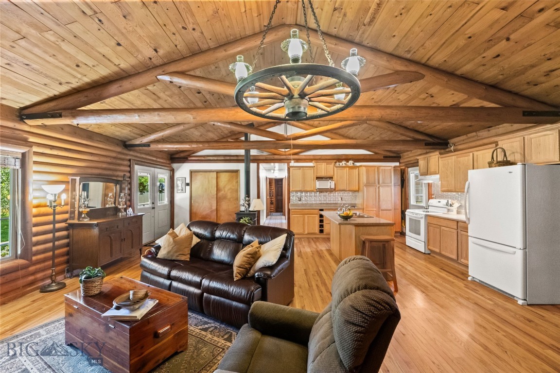 Located just minutes from the North Entrance of Yellowstone National Park, this log home is set on a private 1-acre lot with views of the Yellowstone River Valley and Electric Peak. The immaculately maintained property includes a 3-bedroom/2.5-bath main home and a 2-bedroom/1-bath apartment above the garage ideal for guests or added income. Inside the main home, enjoy the cozy log cabin atmosphere created by the fireplace, hardwood floors and rustic accents. In the winter months, enjoy the bright sunroom off the Westside of the home that give the sense of being outside but with the warmth of the home. Relax in the backyard oasis complete with mature aspen groves, lilac hedges and conifers that create both privacy and shade. This property is in a prime area and offers excellent investment potential. The proximity to the North Entrance of Yellowstone, Yellowstone Hot Springs and the blue-ribbon Yellowstone River make it attractive for long-term tenants or those seeking lodging. Adventure is always within reach just minutes from the front door. Schedule your viewing today!