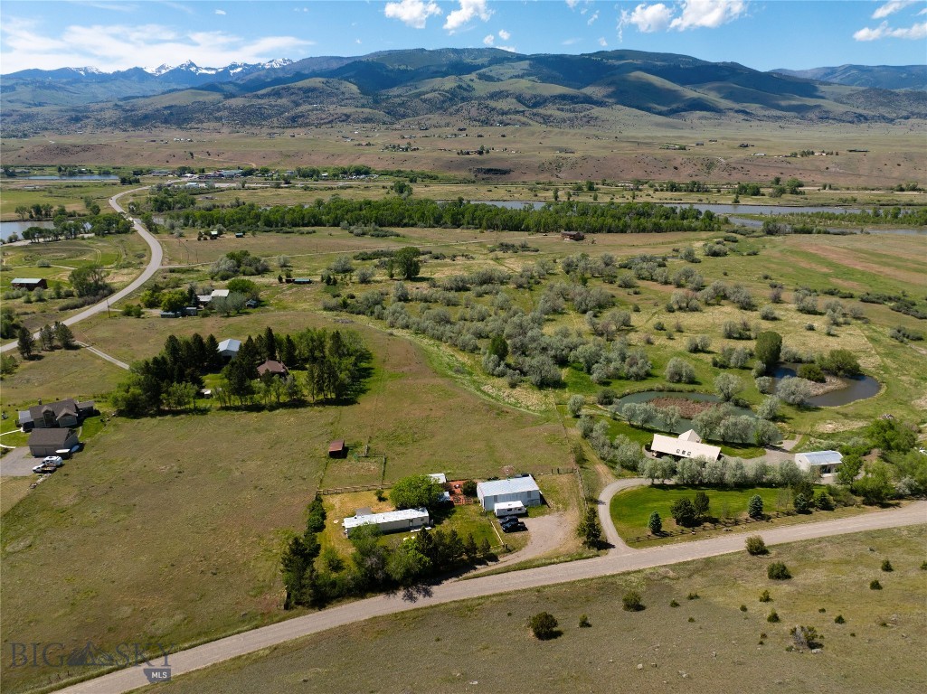 LOCATION! LOCATION! LOCATION! Nestled perfectly in the heart of Paradise 
Valley, properties in this area rarely come up for sale. Animals such as 
sandhill cranes, moose, elk, deer, the neighborhood horses, a resident owl, 
and even bears can be seen wandering through. It is a veritable wildlife 
sanctuary! 6.43 beautiful acres roll down the hill to an easement accessing 
1/23rd of shared ownership of an additional 23 acres on the renowned 
Yellowstone River. You can hike, hunt, fish, swim, raft and recreate any 
time, practically without leaving home! This beautiful, magical, SPECIAL property has 
so many possibilities. Whether you’d like to build your dream home in place 
of the manufactured home on-site; or keep that as a short- or long-term 
rental and build another home just down below on a phenomenal build site 
(with breath-taking views of Emigrant Peak/Absaroka Mountain Range and the spectacular Gallatin 
Range), the options are endless. An added bonus: a great large shop on 
the premises for your toys, equipment, or ample room to indulge in your 
hobbies. Enjoy gardening? A beautiful, fenced garden with a well-organized 
shed will let you indulge! Within three miles are the following amenities: a 
Valley favorite restaurant and watering hole, the Emigrant Outpost (within 
walking distance); Emigrant General Store (“if they don’t have it, you don’t 
need it”), including fuel; The Old Saloon with its awesome summer concert series; a bank, 
Post Office, barbecue joint, and organic bakery; the enchanting Sage 
Lodge for those special occasions, and the legendary Chico Hot Springs! 
This property has the best of all worlds, privacy and seclusion coupled with 
easy access to the roads (even in winter). The only year-round entrance to 
Yellowstone National Park is only 30 miles south, the quaint Western town 
of Livingston is 20 minutes north, and the vibrant and bustling college town 
of Bozeman is within 45 minutes, Bozeman International Airport just a little further. The FEEL of this amazing place is what’s 
going to “getcha”! With too many notable nuances to mention, and with such a beautiful, tranquil, park-like setting, living 
here will feel like a full-time vacation – you really have to see it to believe it. 
Come check it out as soon as you can, as I believe it is just so unique, that it won't last long.