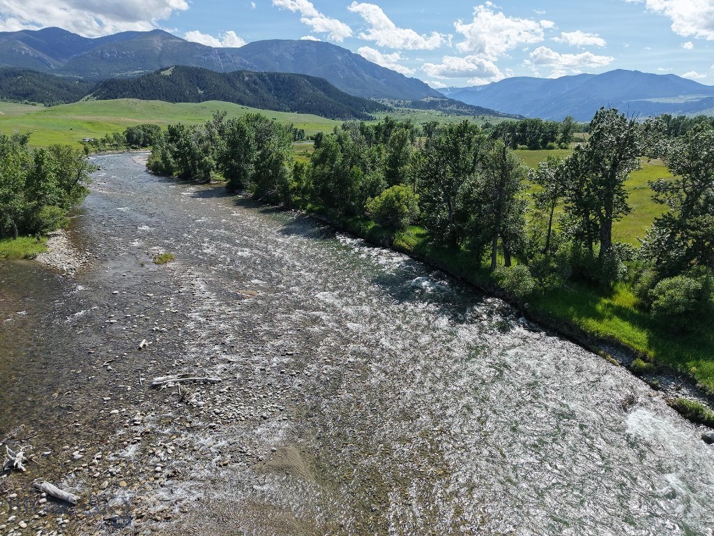 Nestled in the heart of Nye, Montana, Stillwater Legacy Ranch is a rare and remarkable offering that is rich in history and epitomizes the beauty and recreational abundance of the Stillwater Valley. Encompassing approximately 712± deeded acres, this property is framed by nature’s finest elements—rugged peaks, winding rivers, fertile meadows, and expansive nearby public lands. A true sanctuary for outdoor enthusiasts and nature lovers, the ranch is surrounded by the stunning Beartooth Mountains and Absaroka-Beartooth Wilderness. This untouched backcountry yields access to world-class hiking, fishing, hunting, and outdoor adventure, right from your back gate and beyond.
Stillwater Legacy Ranch boasts an extraordinary 1.65± miles of the Stillwater River frontage, complemented by 0.7± miles of both sides of the West Fork Stillwater River flowing through the middle of the property. In addition to these significant water features, the property hosts a network of spring creeks that offer outstanding potential for stream restoration and enhancement, creating both ecological value and fly-fishing opportunities. Adding to its rarity, these natural thermal springs that never freeze over flow year-round through the property, enhancing its appeal, utility, and natural wonder.
Originally homesteaded in 1896, this working ranch has been owned and operated by the same family for 129 years. It has earned distinction as a Montana Historical Ranch and is a treasured part of the state’s ranching heritage. 
Agriculturally, the ranch supports approximately 80± acres of flood-irrigated land planted in a productive creeping meadow foxtail and orchard grass mix, offering potential for hay production or livestock grazing. Improvements on the property include three modest homes, a barn, a garage, and four sheds—ideal for supporting an active agricultural lifestyle. 
Stillwater Legacy Ranch is ideally situated just 45± minutes from Columbus, 1± hour from the charming town of Red Lodge, and 1.5± hours from the commercial hub of Billings. Whether you’re seeking a private retreat, a working ranch, or a family legacy property, Stillwater Legacy Ranch offers unmatched natural beauty, abundant flowing waters, historic prestige, and remarkable privacy.