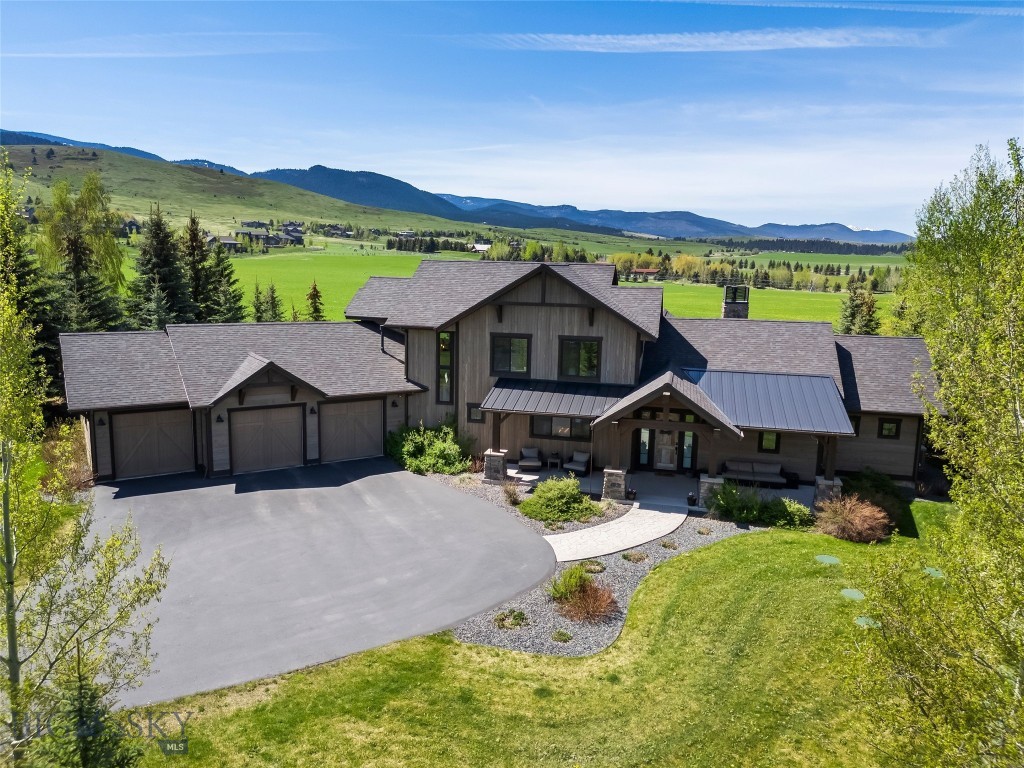 Located in the highly sought-after Greenhills Ranch subdivision, this custom home is sure to impress and lives much larger than expected with its vaulted ceilings and thoughtfully designed open floor plan. Situated on one of the premier view lots in Greenhills Ranch, the backyard perfectly frames the breathtaking Spanish Peaks and backs to a protected 100-acre conservation space that cannot be built on, offering exceptional privacy and permanently preserved views.

Set on over an acre of beautifully landscaped property, the home provides a peaceful retreat where quiet summer evenings can be spent enjoying stunning sunsets and abundant wildlife from the back patio. Reclaimed barn wood accent walls add warmth and character throughout multiple rooms, creating a refined blend of rustic Montana charm and modern comfort. The floor plan is both functional and inviting, featuring a spacious primary suite and a secondary en-suite bedroom on the main level. Upstairs, you’ll find a generously sized family room, two additional bedrooms connected by a Jack-and-Jill bathroom, and a dedicated office space.

With Hyalite Reservoir and endless year-round recreation just minutes from your doorstep, you’ll have quick access to hiking, boating, fishing, paddleboarding, camping, and some of the area’s most scenic trails. Whether you’re looking for adventure or a peaceful retreat, this property offers the best of Montana living in one of Bozeman’s premier communities.