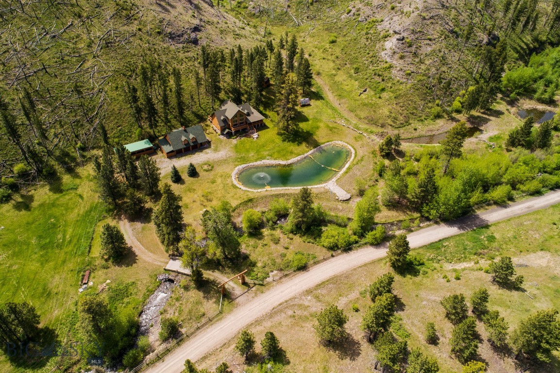 Set beneath the Beartooth Mountains and the Absaroka Range just a few miles east of Gallatin National Forest and in the West Bridger Creek drainage, this exquisite mountain sanctuary features a custom 4,232± square foot home and guest quarters on 39± deeded acres. About 750 feet of both sides of West Bridger Creek cascades by the home, just 35± minutes from Big Timber, Montana. The easily manageable acreage includes a diverse array of mature timber and mountain meadows and a beautiful pond outside the home’s large picture windows, providing habitat and water for big game, birds, small mammals, and other wildlife.