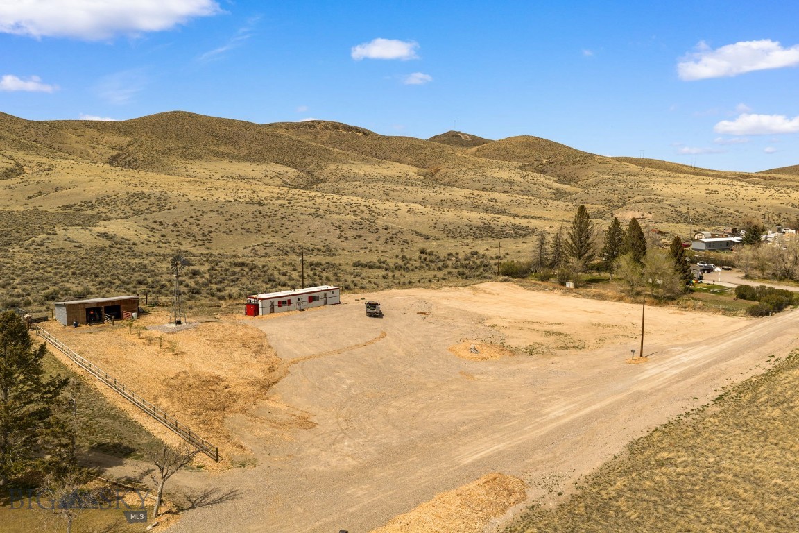 Discover the perfect blend of privacy and convenience with this 1.77-acre property just minutes from Dillon. Tucked away at the end of the road, this parcel offers a peaceful setting with plenty of space to make it your own—free from covenants or HOA restrictions.

The property is already equipped with a private well and septic system, saving you time and expense. A mobile living structure is in place, along with a windmill and a run-in barn that will convey with the sale—ideal for livestock, storage, or future improvements.

Whether you’re looking for a homesite, an investment opportunity or a small hobby property, this land provides flexibility and freedom in a scenic location close to town amenities.