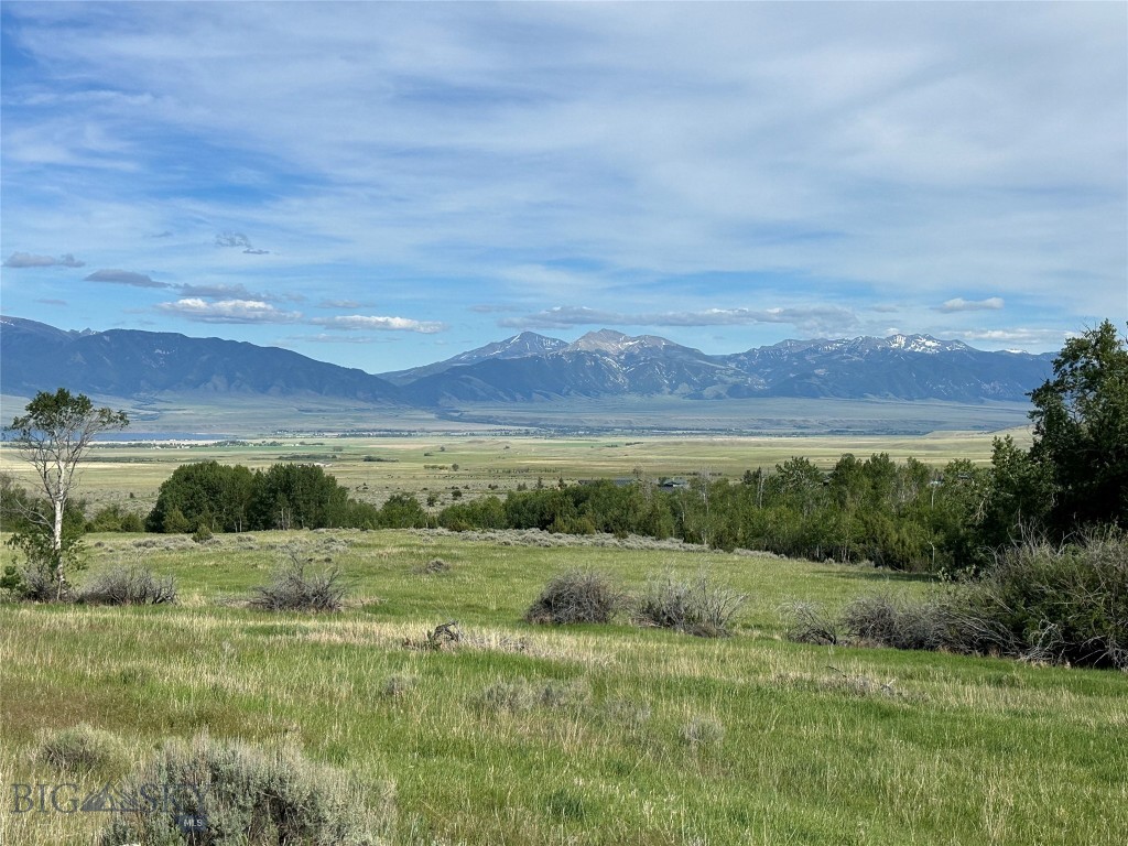 One of the last opportunities in the highly sought-after Stone Ridge Views Subdivision, this exceptional ±10-acre parcel is among the finest lots in the community. Offering unobstructed, panoramic views of the Madison Valley, Madison Range, Ennis Lake, and the Tobacco Root Mountains, this property delivers a truly breathtaking Montana backdrop in every direction.

South Meadow Creek runs adjacent to the property, enhancing the sense of tranquility and natural beauty. The thoughtfully repositioned building site is perfectly placed to maximize sweeping vistas while maintaining privacy and serenity. Power and fiber optic are available at the lot, providing modern convenience in a pristine setting.

Located at the base of some of Montana’s premier recreation, North and South Meadow Creek areas offer endless outdoor opportunities. Ennis Lake is just minutes away, while world-class blue-ribbon fishing on the Madison River is close by.

Approximately 20 minutes from Ennis and less than an hour from Bozeman, this property offers a rare balance of seclusion, accessibility, and unmatched scenery—an ideal canvas for your Montana dream home. Opportunities like this are increasingly rare.