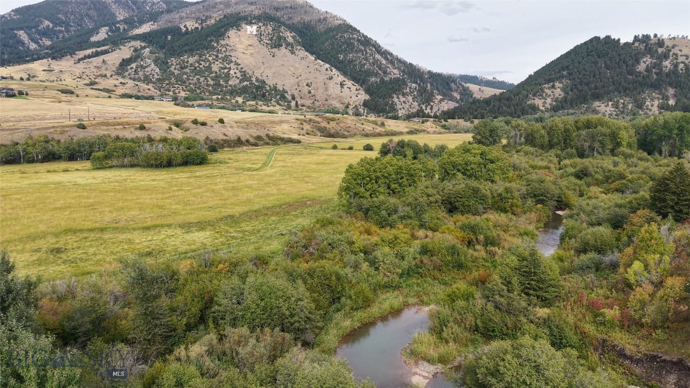Welcome to Bridger Creek Retreat. These 42 acres represent an uncommon opportunity to
create your Montana vision from the ground up. Only 5 minutes from downtown Bozeman,
sitting at the doorstep of all Bridger Canyon’s recreational opportunities, the property feels
remote, with multiple attributes of a rural experience.
Bridger Creek, a year round trout stream, forms the property’s southern boundary for ½
mile. The mature riparian area supports an abundant wildlife population of moose, elk, deer and
black bear. Stepping away from cottonwoods and willows, the open meadows with quaking
aspen groves and lush grasses allow for unobstructed views to the south and north east. The
meadows are bordered to the north by the bench portion which acts as a screen, filtering road influence
and creating privacy. The change in elevation and character suggests multiple likely build sites.
Currently a 3 bed, 2 bath home suitable for rental or manager’s quarters is tucked into the
hillside entrance, along with several shops and garage.
The Bridger Creek Retreat’s 42 acres lie in 3 parcels within the Bridger Creek Special Zoning
District and Agriculture Exclusive sub district. Residential use is allowed and conditional uses
may include guest ranches, B&Bs and accessory dwellings. There are flood irrigation rights for
the meadows which historically have produced excellent grass hay.
Recreation begins right outside your door. The iconic “M” Trail and Drinking Horse Mountain
Trailhead are two minutes away. Bridger Bowl is 15 minutes up the road along with the entire
canyon’s beloved hikes, biking trails and camping locations.
The Bridger Creek Retreat reflects the best of what living in the Gallatin Valley offers; mountain
views, open space, endless recreational opportunities, only 5 minutes from the best downtown
in Montana. Bozeman offers world class dining, shopping and cultural experiences when you
need your espresso fix and yet gives that quick escape back to your private space.
Are you looking for the perfect place to bring your Montana retreat, equestrian estate, multi
generational compound or simple luxury private home vision to life? This is it.