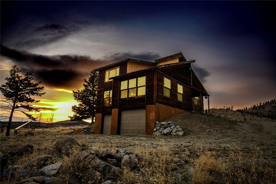 Montana Mountain Retreat on 20+ Acres with $25,000 Buyer Credit to Customize Your Exterior. 

Experience true Montana living on over 20 private acres with sweeping views of the Highlands and Tobacco Root Mountains. This 2-bedroom, 1-bath home offers a rare opportunity to create your ideal mountain retreat—while the seller contributes $25,000 toward exterior siding or upgrades of your choice.

The home features a functional layout with a main-level bedroom and bath, plus a versatile bonus space ideal for guests, an office, or additional sleeping area. Vaulted ceilings and large windows bring in natural light and capture the surrounding landscape, while the attached garage/shop space provides ample room for vehicles, storage, or a workshop.

Designed for flexibility, the property is currently powered by solar with generator backup, with grid power available at the lot—giving buyers the option to remain off-grid or easily connect to traditional utilities.

Step outside and enjoy unmatched privacy, abundant wildlife, and endless recreational opportunities right out your door. Whether you're looking for a full-time residence, seasonal getaway, or investment in Montana land, this property offers both lifestyle and upside potential.

With the $25,000 credit, buyers can finish the exterior to their exact style and build immediate equity. Acreage properties in this price range rarely offer this combination of views, privacy, and customization potential

Conveniently located within reach of Whitehall, Butte, and surrounding outdoor recreation areas, this is your chance to own a piece of Montana with room to make it your own.