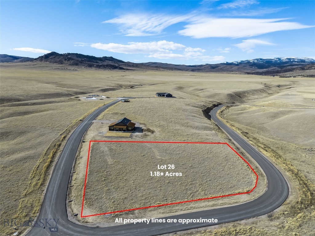 Lot 26 offers 1.18± acres within a thoughtfully planned 55-lot community, with parcels ranging from approximately 1 to 2 acres. The subdivision spans 165± acres total, providing generous open space and excellent opportunities to enjoy local wildlife. Paved roads are in place, with mailboxes, power, and fiber optic service to each lot. Located approximately three miles from downtown Ennis, this property offers sweeping views in all directions and convenient access to town amenities. Wells throughout the subdivision range from approximately 200 to 350 feet in depth, producing 12 to 60± GPM. The licensed Montana listing agent is a member of the selling entity & can only represent the seller.
