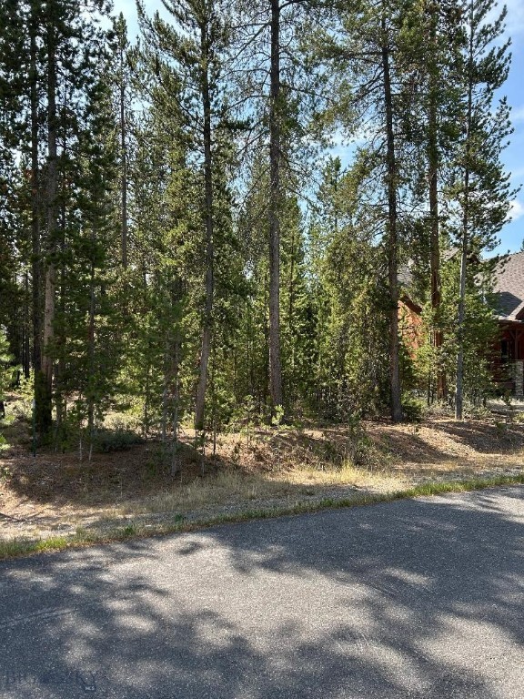 Desirable Madison Addition lot tucked in a private location on a lovely Cul-de-sac.  One of the larger lots in the subdivision in a neighborhood of attractive single-family homes.  Discover the perfect blend of beauty and convenience of town amenities.  This location offers prime opportunity to be in the heart of Yellowstone Country only minutes from town shops, school, events, year-round trails and adventures.  All the city services are available to the lot.  Feel more like you're off the beaten path in this neighborhood with the added privacy buffer of the timbered public park in the center of the court.  Opportunities like this are few and far between with only a handful of vacant lots remaining in the subdivision.  Build to your specifications, creating your dream home in a highly sought after Madison Addition location.  Whether you're ready to design and build or simply wanting to secure your future homesite.  Don't miss your chance!