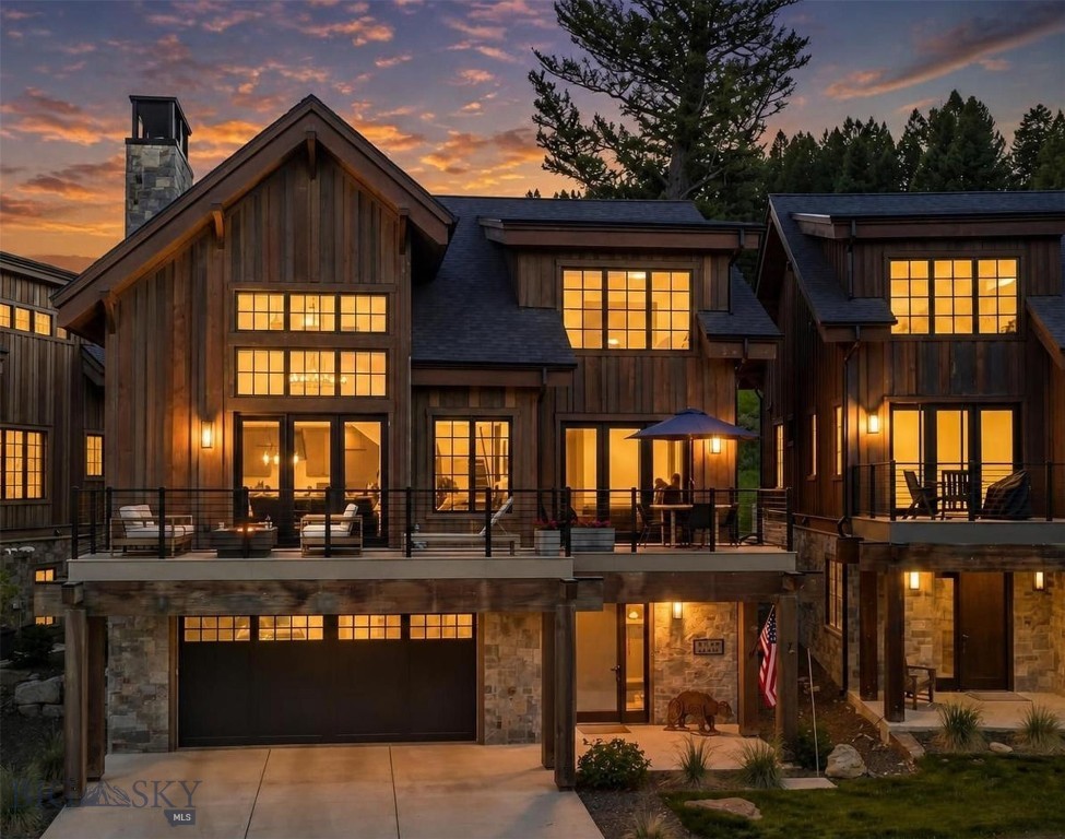 On a sunlit hillside above the heart of Big Sky, this residence was built around light, views, and the ease of mountain living. Three levels rise across the home, each floor creating both privacy and places to gather. Free standing, with no shared walls, it lives like a private home with the ease of condominium ownership.
Custom finishes carry through every room, quiet and deliberate, the kind of craftsmanship that rewards a second look. The kitchen sits at the center of it all, built for those who cook and host in equal measure. Wolf appliances, generous counter space, and an open flow into the dining and living areas make it easy to manage a quiet dinner or host a full house of family and friends.
Two living spaces give the home its range. The main gathering room opens to the view and anchors the entertaining floor. Upstairs, a loft turns to play: a handsome pool table at its center, a game table for cards and long evenings, and lounge seating that invites everyone to stay a while. Five bedrooms, each with its own ensuite bath, make room for family and guests alike, with privacy enough that no one has to trade comfort for company.
Outside, private decks extend the living space into the open air. An outdoor hot tub waits for evenings after a day on the mountain. There is room to linger over morning coffee, to gather as the light turns gold over the range, and to settle in beneath a clear night sky. A two-car garage handles gear, vehicles, and everything a mountain season asks you to carry.
The location anchors it all. Big Sky's town center sits close for dining, shopping, and summer concerts. The Gallatin River is a short drive away. One&Only Moonlight Basin, Montage Big Sky, and the world class skiing at Big Sky Resort are all within easy reach. Yellowstone National Park, Bozeman, and the Madison River are each about an hour's drive.
A home like this answers to whatever you ask of it. A primary residence rooted in the mountains. A second home for the seasons that matter most or vacation rental with bones guests look for: five ensuite bedrooms that sleep a group in comfort, a game loft and hot tub that fill the hours off the mountain, and a location within reach of the resort, the town center, and the rivers.

Mornings open with light across the range. Evenings close beneath a sky full of stars. Between them sits a home made for every season.