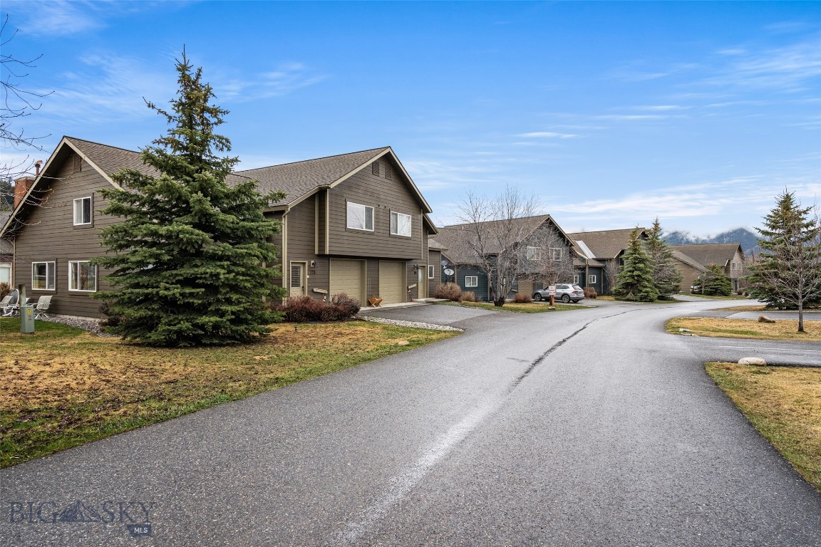 Welcome to 173 Candlelight Meadow Drive, a well-kept 3-bedroom, 3-bath Firelight Chalet in one of Big Sky’s most convenient neighborhoods. This end-unit offers added privacy and a quiet setting with open space right outside. You’re a short walk or quick drive from Town Center, with easy access to dining, shops, the BASE community center, and year-round events.
Outdoor access is a key advantage—Big Sky Resort and Lone Mountain Ranch are 10–15 minutes away, and nearby trails, the Gallatin River, and day trips to Yellowstone or Bozeman are all close at hand.
Inside, you’ll find vaulted ceilings, generous natural light, and a newly installed high-efficiency pellet stove. The main level flows comfortably between the kitchen, dining, and living areas. Three bedrooms and three full baths provide practical space for guests or full-time living, and the fresh, bright interior paint gives the home a clean, updated feel.
For convenience, two overflow parking spaces sit directly across the driveway—ideal for guests or additional vehicles.