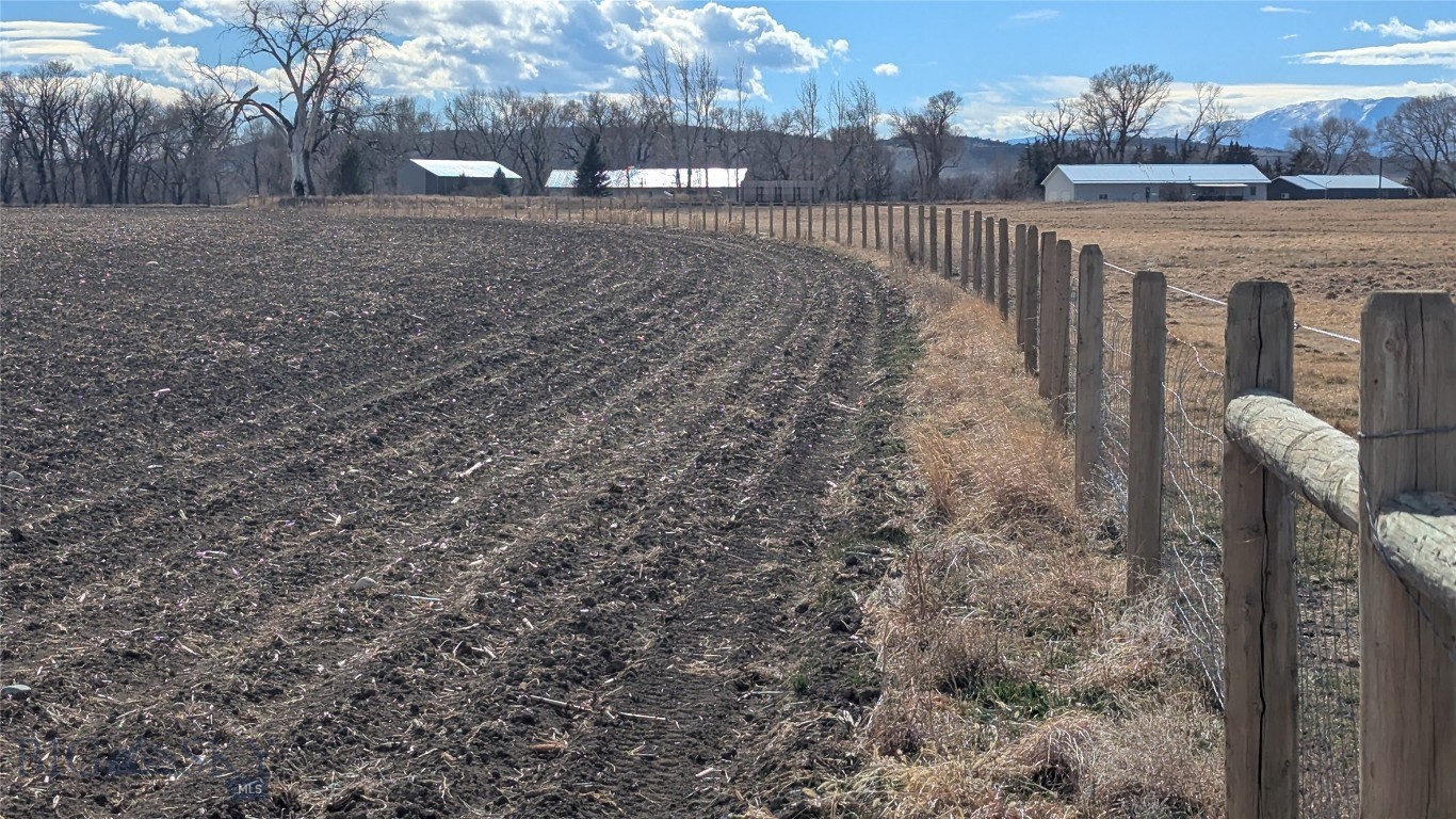 If you're looking for productive irrigated land in a beautiful rural Montana community, please consider these 260 acres.  Irrigated by one seven tower "Valley" full circle pivot and a "T&L" eight tower pivot with a corner arm half circle.  Both pivots are gravity fed with a booster pump at the center of each.  Both booster pumps are electric.  Access to this property is by county road "Lower River Road" depending on the map you're using.  Irrigation comes from water out of the Orchard Canal.  Both pivots run out of one headgate and can operate at the same time. The views of the Absaroka Beartooth Mountains are expansive and building sites exist to capture the views. This property has an annual agricultural lease, please see associated documents for more details.