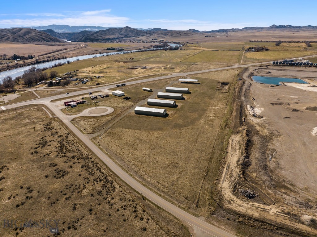 Opportunity Knocks on Hwy 287: 17.99 Acres of Prime Commercial Land!! 
Located in the center of the Montana’s Golden Triangle of Bozeman/Helena/Townsend/Butte, this commercial property located at 8866 Hwy 287, Toston, MT presents an exceptional chance to establish OR to expand your business in a thriving Montana locale.This 17.99-acre parcel, strategically located on a major thoroughfare in one of Montana’s growth corridors, offers unparalleled visibility and direct highway frontage and easy access from both Hwy 287 AND Hwy 285, making it ideal for a wide range of commercial ventures.Historically used as a waypoint for a Montana Hay Company, the improvements include 4 enclosed steel and wood framed buildings, each measuring 50x144x16, 1 open steel frame building of the same size & a building with an office/live work area of appx 330 SF with a kitchenette, 3/4 bath & an adjoining open 4-bay garage. Additional infrastructure benefits include perimeter fencing, well, septic and electricity. The potential for 3-phase power is a viable option as the neighboring property owner installed it near the NE common property line. 
Potential Future Uses/Highlights:
•Expansive Acreage: This property provides ample space for large-scale development, accommodating diverse business needs from industrial operations to retail complexes or hospitality services.
•Ideal for Industrial/Warehouse Facilities: The expansive acreage & highway access are perfect for logistics, storage, or light manufacturing.
•Retail Outlets: High traffic counts make this an excellent site for gas stations, convenience stores, quick-service restaurants, or general retail.
•Hospitality/Tourism: Consider a motel, RV park, or other tourist-oriented businesses to capitalize on the flow of travelers.
*Service-Oriented Businesses: Any business requiring direct customer access & visibility will thrive here.
•The location on Hwy 287 offers an excellent opportunity for a recreational business with immediate access just across Hwy 287 to a Missouri River boat “put-in” & quick access to Canyon Ferry Lake.
•Proximity to Local Amenities, Recreation & Scenic Montana Landscape: Beyond its commercial appeal, the property benefits from the stunning natural beauty of Montana, potentially enhancing its desirability for businesses that cater to visitors or those seeking a rural Montana work environment.
Don't miss this rare opportunity to secure a significant commercial presence in a strategic Montana location!