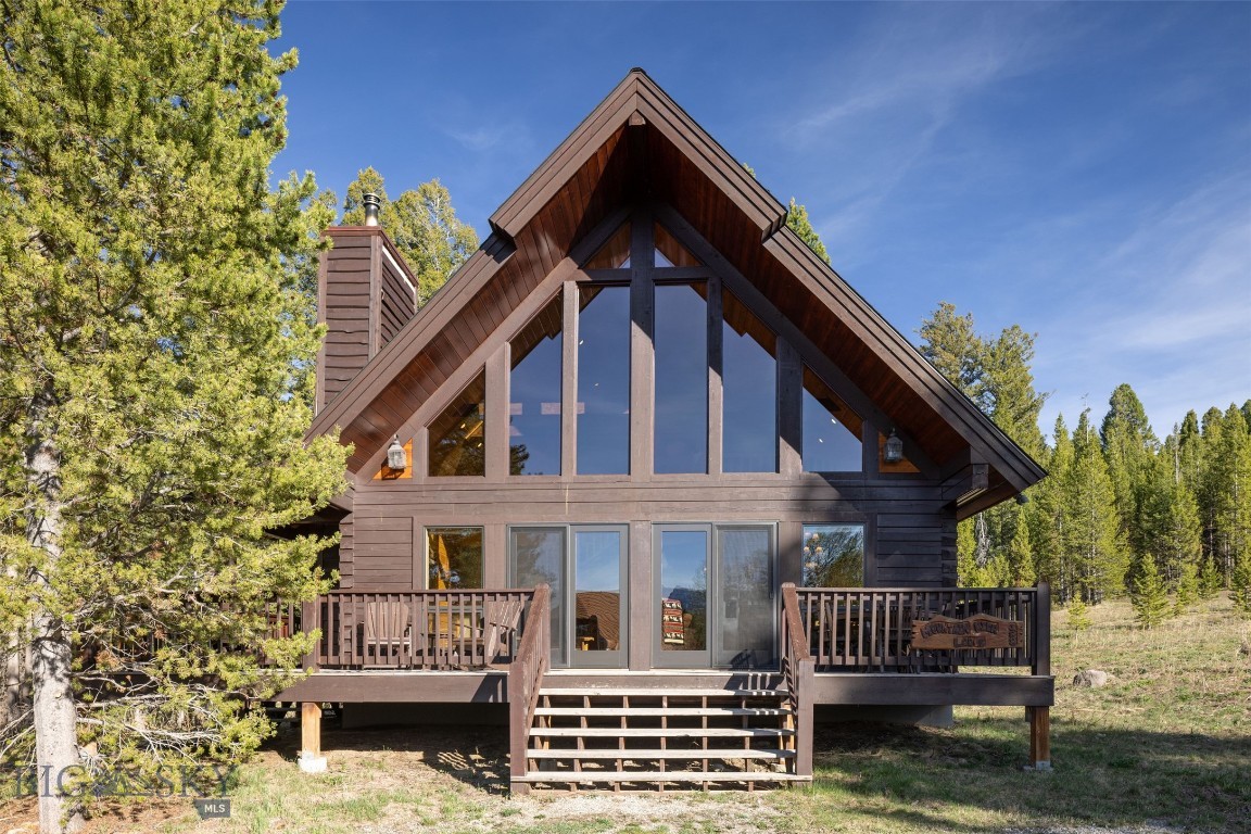 This beautiful mountain retreat backs directly to the National Forest, offering immediate trail access to world-class snowmobiling, hiking, biking, ATV riding, fishing, and exceptional wildlife viewing right from your backyard. Whether you’re searching for a full-time residence, private getaway, or income-producing investment, this property presents a rare opportunity to own a short-term rental property just 7 miles from the west entrance of Yellowstone National Park and the charming town of West Yellowstone. Situated on a peaceful .5-acre lot, this spacious 1,575 SF, 3-bedroom, 3-bath cabin features a proven five-star rental history and is sold turnkey and fully furnished, making it ready for immediate enjoyment or rental income. Ideally located near Henry’s Fork Lake, Harriman State Park, Island Park, and endless year-round recreation opportunities. With most homes in West Yellowstone prohibiting short-term rentals, this is an exceptionally rare and highly desirable offering. No HOA. Two additional adjacent homes available. See MLS #411348.