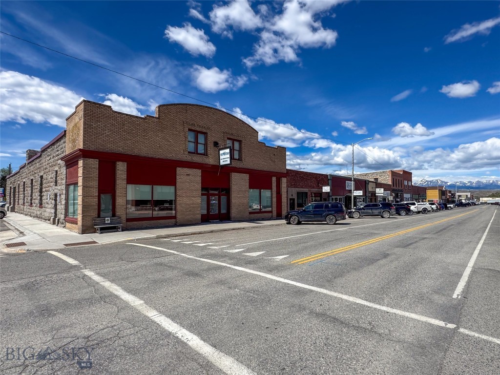 Located in the heart of downtown Big Timber, Montana, 236 McLeod Street offers a rare opportunity to own a substantial and versatile commercial property with income-producing potential already in place. Encompassing over ±9,680 square feet, this historic building combines strong street presence, flexible commercial space, and modern updates in one of Montana’s most authentic western communities.

The property currently features a street-front commercial tenant, providing immediate rental income and excellent visibility along McLeod Street. Behind the retail frontage lies a spacious shop and warehouse area that has been newly rewired and upgraded with new lighting, creating a highly functional space ideal for storage, light industrial use, manufacturing, trades, inventory, equipment, or additional commercial tenants.

Adding further value and flexibility, the building also includes a one-bedroom apartment that offers additional income potential or on-site living accommodations for an owner, manager, or employee.

With its combination of downtown frontage, warehouse capability, updated infrastructure, mixed-use functionality, and existing income streams, 236 McLeod Street presents a unique investment opportunity in the growing Big Timber market. Whether you are seeking a commercial headquarters, income-producing asset, live/work setup, or redevelopment opportunity, this property offers the size, character, and versatility to bring a wide range of visions to life.
