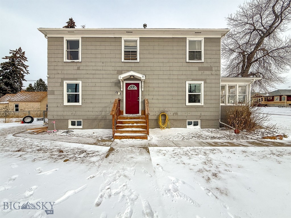 Updated classic colonial home with 7! bedrooms on three levels, a corner lot, and a detached two car garage. Main level invites you in with original hardwood floors, an open dining and living room, with fireplace, a compact kitchen, a half bath and a bright sunroom which runs along the whole south side of the home. The charming old banister leads you upstairs to three full bedrooms with large closets and a full bathroom with a modern vanity. On the lower level, you will find 4 bedrooms; none are official egress, but they all have windows and plenty of closets, plus the laundry room. Approximately 2808 square feet on all 3 levels and this 1943 home sits on a .17 acre lot. Front porch and back deck invites entertaining. Lot is partially fenced for animals. Small shed included. Newer roof on home and garage, per seller. New hot water tank 2025. Easy access to everything Great Falls offers, including base.