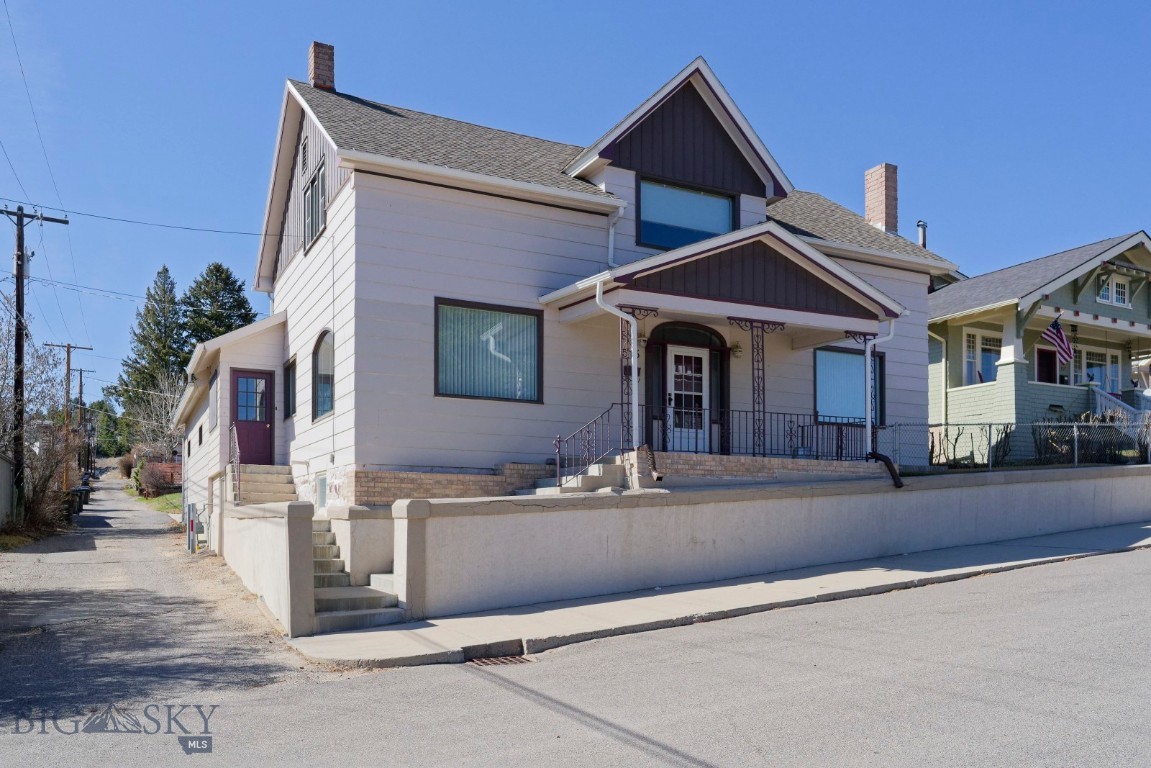Spacious home completely remodeled in the early 1990's. Situated on a hill in the Uptown Area near "Big Butte". This home has great curb appeal and is very well kept. The siding, roof and windows are all new as is a gorgeous leaded glass window with an arch above a window seat in the formal dining room. Two lighted china cabinets complete the permanent amenities. Off the dining room is the kitchen with oak cabinets, black appliances and formica counters with both the backsplash and floor tiled for easy care. Off a hardwood hall floor study is living room access and the living room is very large with a woodburning stove. off the kitchen is an enclosed exit/entry which is a covered patio, with knotty pine walls and access to an oversize 2 car garage A stairway with original banister leads to the second floor with a small landing space and access to all three bedrooms. The primary bedroom is very large with a huge walkin closet. Two of the bedrooms have gravity heat, but the owner is putting in electric baseboards heaters. Downstairs the basment is clean and dry with copper plumbing, workshop table, gas forced air furnace and granite foundation. The home was rewired in 1989. There is an outside exit from the basement. On the exterior are walk walkways and a retaining wall which have been reinforced. A small parecel of land (412 sq ft) belongs to the owner of this property.