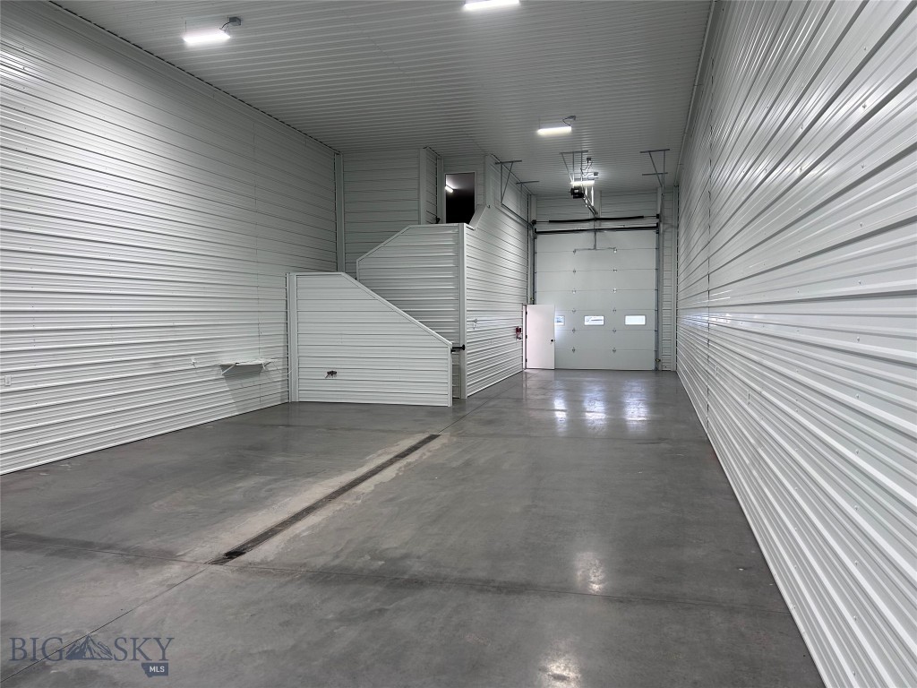 Nice new build warehouse units in convenient location just a block off Jackrabbit Lane in Belgrade city limits right behind Wendy's and Goodwill. The main level of Unit 2 is 1,948 SF of mostly open warehouse space with a windowed office and restroom. There is a large overhead door into the warehouse space, and a man door into the office/showroom space. The mezzanine level is an additional 255 SF. The building location and design work well for warehouse/workspace; customer facing business; shop/office combo, and more. Also available for lease at MLS # 400707.
