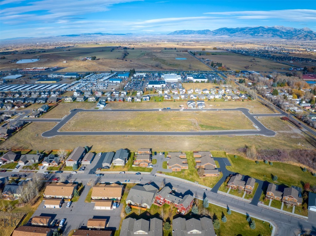 New single-family subdivision lots ready to build. Woodbury Grove Subdivision combines the beauty of Montana's rural landscape with the convenience of living just minutes from everything Bozeman has to offer. This subdivision offers wide streets and sidewalks creating a neighborhood feel rarely found outside Bozeman city limits. A Master Plan designed to create multiple living options from single family homes to townhouse lots and a few condo units will create an intimate community for every home as the development grows. Traditional architecture, responsible design, quiet streets, and more make Woodbury Grove perfect for families with children to build a community together over time. Located on the west side of Bozeman, 10 minutes from downtown or 10 minutes to the Gallatin River.