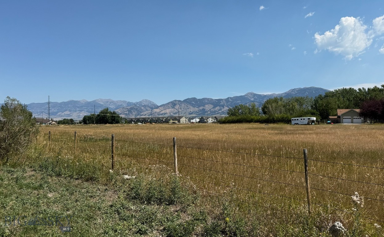 Prime vacant lot in heart of Bozeman! Zoned R-2 with multiple possibilities. Don't miss out on this opportunity to own a beautiful lot in Bozeman's desirable Oak Springs! Zoned R2, this property offers flexibility for your future...build a single-family home with an ADU, a duplex or explore a duplex with ADU potential. Enjoy peaceful surroundings with the lot backing up to open land, offering privacy and open space. Located just blocks from Gallatin Regional park, trails, and all that Bozeman has to offer. Whether you are looking to build your dream home or invest in a versatile piece of land, this property offers location, views, potential and lifestyle. Your future starts here!