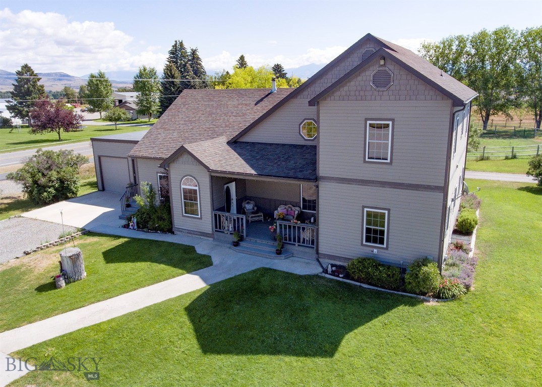 **Live-Work Dream Property in Manhattan – No Covenants or HOAs! Spacious 4 Bed / 4 Bath Home / 810 sqft 4+ Car Heated Garage + Heated Shop on nearly ½ acre. Discover the perfect blend of home comfort and workspace functionality with this stunning 4,600+ sq ft custom home on a beautifully landscaped 0.48-acre lot in scenic Manhattan. Ideal for entrepreneurs, tradespeople, or anyone seeking flexible living with unmatched Montana charm and freedom—no covenants, no HOA restrictions. Large kitchen with huge pantry, great room with 2 story vaulted ceiling, main floor master bedroom, upper bedrooms with full jack n jill bath. Open floorplan with beautiful wood accents, radiant floor heating, central vacuum system, water softener, kitchen counters are from the Historic Manhattan Bowling Alley, Unique Old-School light fixtures, a private office with separate entry – ideal for In-Home Business! 
*Shop Details: 30’ x 40’ Heated Wet Shop Ready for mechanics, woodworkers, cabinet makers, countertop installers, and more Fully equipped with 1/2 bath and ceiling tube heating – a true turn-key professional workspace along side shop, you'll find a motorhome parking area with septic clean out site.
*Outdoor Living: Covered front porch with mountain views & unforgettable sunsets. Expansive back patio with fire pit, hot tub (covered), and open-air lounging. A rare find for entertaining or peaceful evenings under the Big Sky. This one-of-a-kind live-work property combines thoughtful craftsmanship with practical amenities, all in a location that celebrates Montana’s independent spirit. Whether you're looking to run a business from home, enjoy room to grow, or simply settle into a unique and welcoming space, this home is a must-see!