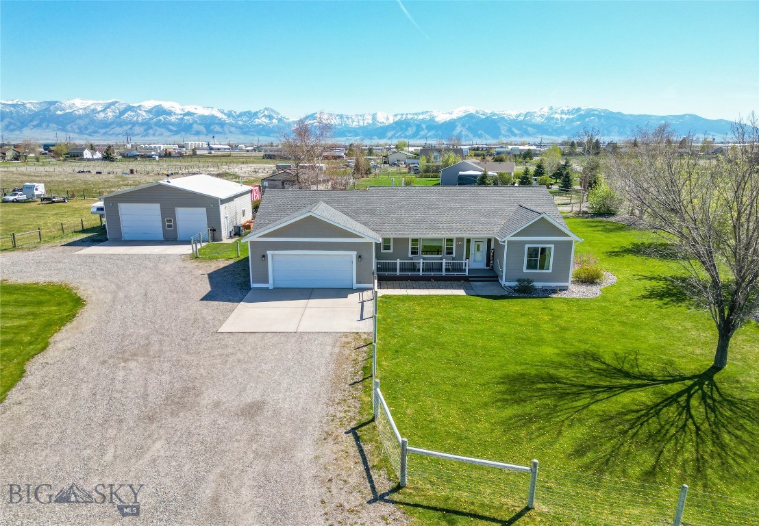 Situated on a rare 1.649-acre lot, this updated and well-maintained single-level home offers a spacious open floor plan with vaulted ceilings and central A/C. The 3-bedroom, 2-bathroom layout includes two living areas, an updated kitchen with stainless steel appliances, and updated flooring throughout.

The property is ideal for outdoor enthusiasts and hobbyists, featuring a standout 35x40 insulated and heated shop.  The north side of the property is ideal to expand for horses with the perimeter fencing.  The shop is equipped with large overhead doors, 220V power, concrete floors, and a French drain. In addition to an attached two-car garage, the property includes an RV parking area with water and power available.

The exterior offers mature landscaping with underground sprinklers and a drip system.

This is a rare opportunity for single-level living on acreage with a shop, located just minutes from both Bozeman and Belgrade amenities.