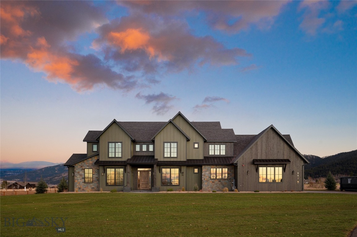 Set against the breathtaking backdrop of SE Bozeman's sweeping mountain vistas, this home embodies the perfect blend of tranquility, modern luxury & thoughtful efficiency. This newly built 5-bedroom, 4.5-bathroom home rests on 1.245 acres, backing to dedicated open space & farmland for unobstructed views of the Gallatin Range & abundant sunlight year-round. Exquisite craftsmanship & refined finishes define the open-concept floor plan, designed for seamless indoor-outdoor living. At its center lies a chef's kitchen appointed with gourmet appliances, a Butler's Pantry, and a large storage pantry—flowing effortlessly into the dining & living areas, where expansive floor-to-ceiling windows frame panoramic mountain views & a gas fireplace adds warmth & ambiance. The primary suite serves as a luxurious private retreat, featuring a copper soaking tub, dual walk-in closets, and a private flex room—ideal for a home office, gym, or cozy den. Two of the four additional bedrooms include ensuite bathrooms, providing comfort & privacy for family & guests, while flexible spaces throughout the home adapt to your lifestyle. Engineered for comfort & efficiency, the home features (2) furnaces, (2) AC units, and five heating & cooling zones, ensuring balanced climate control throughout every season. Dual water heaters provide abundant hot water, while a whole-home water filtration system delivers clean, high-quality water to every tap. A spacious laundry & mudroom connect seamlessly to the heated, finished 3-car garage, complete with a dog door for added convenience. Step outside to the expansive covered patio, designed for year-round entertaining. Equipped with (4) Bromic heaters, this inviting space stays warm & comfortable even on cool Montana evenings—perfect for hosting gatherings, dining al fresco, or simply relaxing beneath Montana's wide-open skies while taking in the ever-changing beauty of the surrounding landscape. Just minutes from downtown Bozeman, Montana State University, and the adventure-rich Hyalite Canyon, this home is ideally positioned for year-round outdoor pursuits. Enjoy fly fishing, hiking, mountain biking, and climbing in summer, or skiing, snowshoeing, and ice climbing in winter—the opportunities for adventure are endless. Blending luxury living, energy-efficient design, and the best of Montana's natural beauty, 657 Hyalite View is more than a home—it's an invitation to live a lifestyle, where MT sophistication meets the spirit of the mountains.