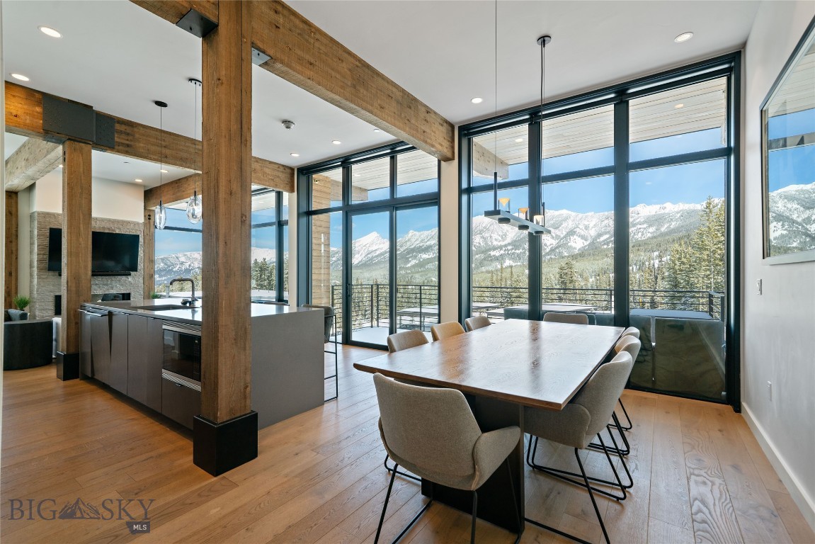 Experience elevated mountain living in this exceptional 3 Bedroom/3 Bathroom corner unit condominium in the LakeLodge at Moonlight Basin, showcasing sweeping, unobstructed views of the Spanish Peaks and Madison Valley. With multiple exposures and expansive windows, the residence is filled with natural light and perfectly positioned to capture Montana’s ever-changing landscape.
The open-concept living, dining, and kitchen areas are designed for gathering after a full day outdoors, complete with a fireplace that creates a warm and inviting atmosphere. Private outdoor space offers a front-row seat to alpenglow sunsets and wide-open Big Sky views.
Life at Moonlight Basin is defined by year-round adventure and effortless access to the outdoors. Step out your door to world-class skiing at Big Sky Resort, miles of private hiking and mountain biking trails, and endless opportunities for alpine exploration. In the summer months, enjoy paddleboarding or relaxing at the private lake, scenic chairlift rides, and long evenings under Montana’s big skies. Ownership at the LakeLodge includes access to its lakefront setting, heated pool and hot tubs, fitness facilities, dining and lounge spaces, and curated programming that brings the community together in every season.
This is more than a mountain retreat — it’s an opportunity to embrace the full Moonlight Basin lifestyle from one of its most desirable LakeLodge locations.