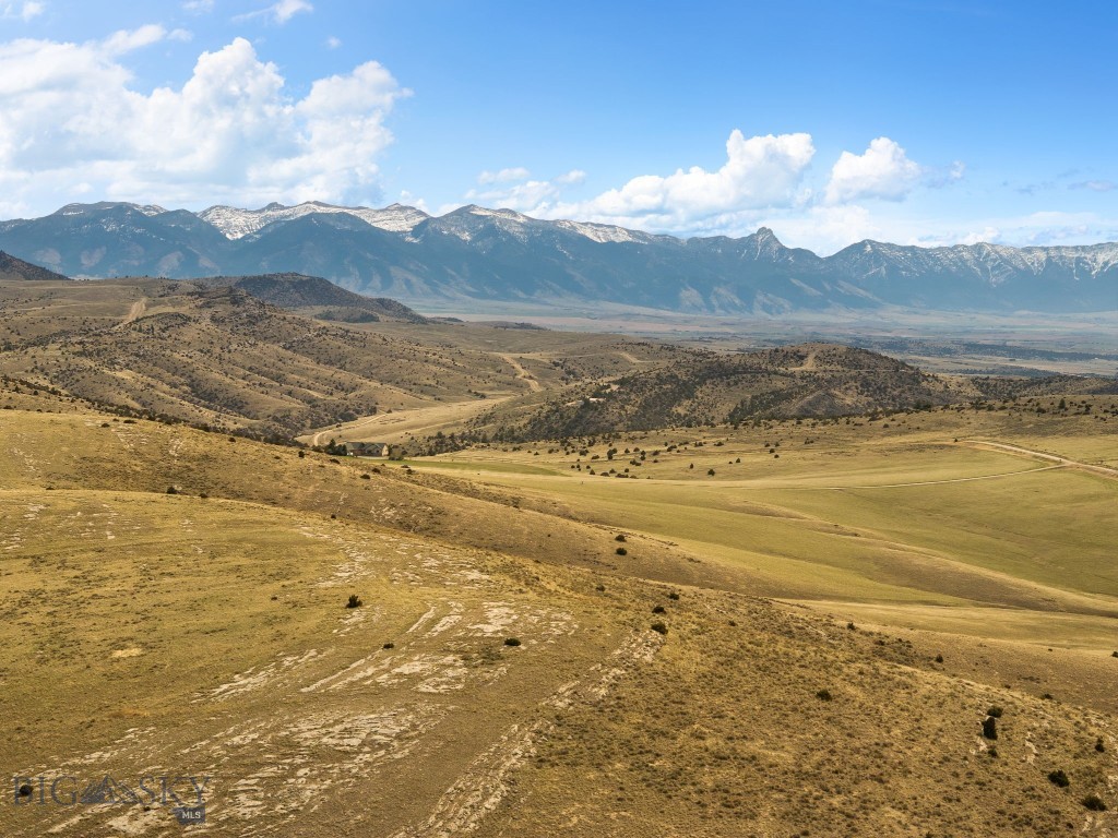 Set at the end of the road for added privacy, this exceptional 19± acre parcel borders State Land and captures protected, unobstructed views of the Tobacco Root Mountains. The homesite is thoughtfully positioned to take in sweeping mountain scenery, while the entire eastern boundary opens directly to 640± acres of State Land, creating a natural extension of your backyard with frequent wildlife sightings. Located within Gallatin River Ranch, a 5,900± acre community just 30 minutes from Bozeman, owners enjoy exclusive access to 2.5 miles of private Gallatin River frontage. Amenities include a riverside pavilion, fire pit, BBQ areas, and expansive common ground—over 1,650± acres—for hiking, horseback riding, and fishing. Surrounded by views of eight mountain ranges and the sweeping valley floor, this property offers both serenity and adventure serving as the perfect spot to build your Montana Dream Home!