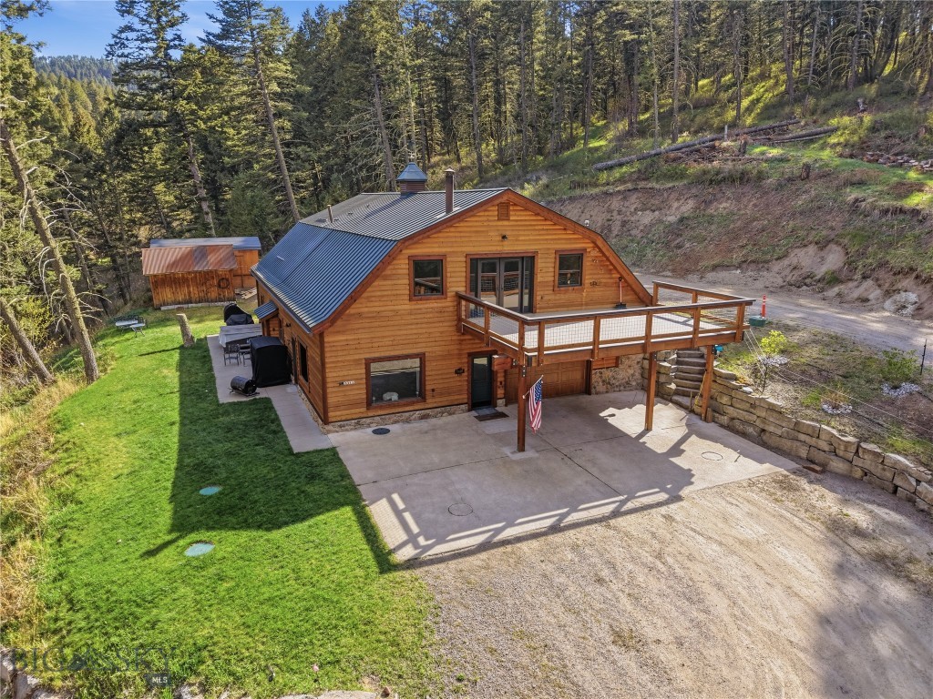 Experience the best of Montana living on 20 private acres just minutes from both Livingston and Bozeman. Surrounded by expansive views, abundant wildlife, and peaceful open space, this 4-bedroom, 4-bathroom property offers a rare combination of privacy, flexibility, and convenience.

Spanning more than 3,200 square feet, the home features a versatile layout designed to fit a variety of lifestyles. The upper level includes its own kitchen, primary suite, and private deck, creating an ideal setup for guests, multigenerational living, rental income potential, or a private retreat. The main level also offers the flexibility of a primary suite, allowing the home to adapt to your needs.

What truly makes this property special is the land. A spring-fed pond welcomes you at the front of the property, while a seasonal pond and natural spring in the back create a setting that is both beautiful and difficult to replicate. Wildlife is a regular part of daily life here, with deer, elk, moose, turkey, and other native species frequently visiting the property.

Apple, pear, and plum trees add to the property's charm, while the acreage provides endless opportunities for recreation and outdoor enjoyment. Whether you're snowshoeing in the winter, mountain biking in the summer, or simply enjoying the quiet surroundings from your porch, this property offers a true Montana lifestyle.

Covered barns and usable ground provide excellent potential for horses, hobby farming, homesteading, or anyone seeking room to spread out and enjoy the outdoors.

Properties that combine acreage, water features, wildlife, and a flexible living arrangement this close to both Livingston and Bozeman are increasingly difficult to find. 116 Elk Ridge Road is more than a home—it's an opportunity to create the Montana lifestyle you've been looking for.