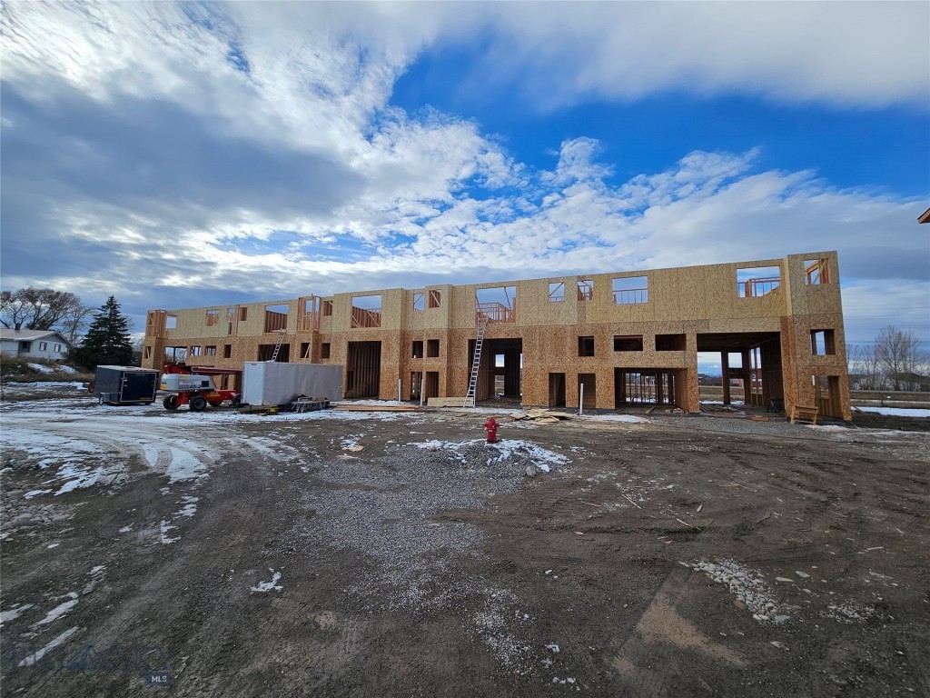 The Fremont Flex+ Plan at Fremont Square delivers efficient design and flexibility for owners seeking a combination of workspace and upper-level living or office options. The main level features approximately 1,280± SF of commercial space with two oversized overhead doors—one 10' x 14' and one 12' x 14'—providing exceptional access for equipment, vehicles, or deliveries. With 15-foot ceiling height and an ADA-compliant bathroom, this space is ideal for trades, small businesses, or personal workshop use. The upper level offers approximately 1,459± SF that can function as an office suite or private residence, complete with two bedrooms and two baths. Conveniently located along Jackrabbit Lane near I-90 and the new Jackrabbit Crossing development, Fremont Square provides high visibility and a strategic location between Bozeman, Belgrade, and Big Sky.