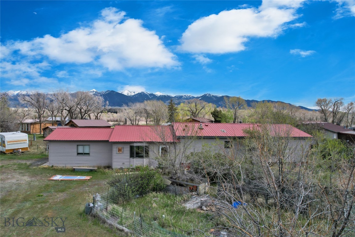 RIVER ACCESS is only 0.2 miles down the road from the property. This is a well kept home just minutes from Twin Bridges or Whitehall. Home has wood heat as well as a brand new propane furnace for the main part of the house. The addition has a woodstove as well as a free standing rinnai style heater. Addition has a nice sliding glass door with a view of the mountains, closet and access to the garage. Inside the main home is 3 BR, 2 BA, large living room with an open floor plan, dining area as well as a nice sized eating bar. The door goes out on a small deck giving you easy access to the complete screened in porch area (289sqft). Enjoy your morning coffee watching the sun rise over the Tobacco Root Mountains or an evening enjoying the stars from the screened in porch and not have to worry about the bugs pestering you! The home has an attached garage as well as a detached garage with an attached workshop area. The detached garage has a bathroom as well as a washer hook up. Hunting, hiking, horseback riding, or using the backroads to explore the mountains in your side by side, you will find a multitude of recreational opportunities. Call today for more information regarding this great property. Please note the square footage is different on the floor plan photo so the tax records may not be correct.