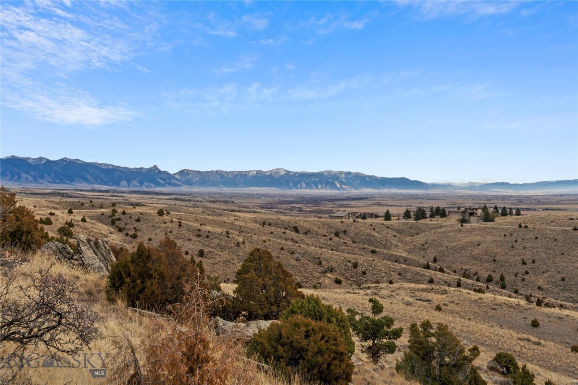 Discover TBD Horse Castle, 20± acres of an exceptional land in Gallatin River Ranch, Manhattan MT. This parcel is part of a 40 acre offering which sits along a dramatic natural rock band on the northern boundary, showcasing rugged beauty, sweeping valley vistas, and layered mountain views. Multiple open build sites offer flexibility for your dream home, barn, or guest quarters. Gallatin River Ranch provides unmatched private Gallatin River access, a state-of-the-art equestrian center, and miles of open space for riding and exploring. Just minutes away, residents enjoy exclusive access to premier blue-ribbon trout waters. The area enjoys a warmer micro-climate with lighter snowfall while still positioned within 1–2 hours of top ski destinations. Despite its privacy, the location is exceptionally convenient—only 10 minutes to Manhattan, 20 minutes to Yellowstone International Airport, and 30 minutes to Bozeman. These 20± acres deliver views, recreation, and accessibility, offered separately or together with the adjoining parcel for a full 40-acre opportunity.
