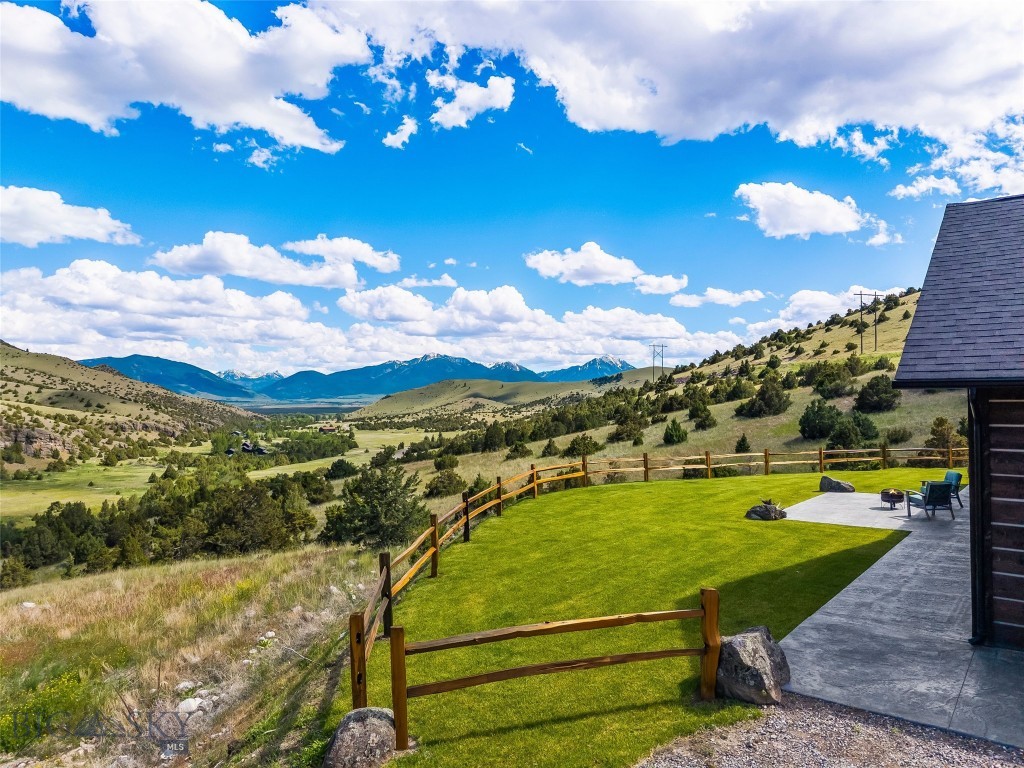 Perched atop 34 private acres at the end of the road in the highly sought-after Trail Creek area south of Livingston, this exceptional custom-built retreat offers a rare combination of privacy, craftsmanship, and breathtaking Montana scenery.
Built in 2022, the 2,384-square-foot single-level home was thoughtfully designed to embrace its setting — capturing sweeping views south down Paradise Valley, across the Absaroka-Beartooth Range and Mill Creek drainage, and toward a dramatic rock band formation that creates a stunning natural backdrop. Elk, deer, and other wildlife are frequent visitors.
Inside, circle-sawn fir floors, wood ceilings, and exposed beams set a distinctly Montana tone. Expansive windows frame the surrounding landscape from nearly every room, filling the home with natural light while maintaining complete privacy — not a neighbor in sight. The open-concept floor plan serves equally well for everyday living and entertaining, with the living room positioned to take full advantage of the views.
The custom kitchen features knotty alder cabinetry, concrete countertops, a rustic walnut island top, and a handcrafted walnut range hood. Knotty alder and walnut finishes continue through the guest and powder baths, while the primary suite elevates the palette with custom walnut vanities, a large tiled walk-in shower, soaking tub, and beautifully finished tile floors. The spacious primary bedroom includes a walk-in closet, ensuite bath, and direct access to the covered patio.
The home offers 3 bedrooms, two and a half baths, a dedicated office, laundry room, and attached garage. Outside, an existing corral suits horses well, and a level cleared building site is ready for a future shop or barn.
Step onto the covered patio and take in panoramic views that stretch for miles — a front-row seat to the evening light washing across Paradise Valley and the surrounding ranges.
With year-round access, no HOA, and end-of-the-road privacy, all just 30 minutes from Livingston, 45 minutes from Bozeman, and an hour from Yellowstone, this is a rare opportunity to own a truly custom Montana home in one of the area's most peaceful and scenic settings.