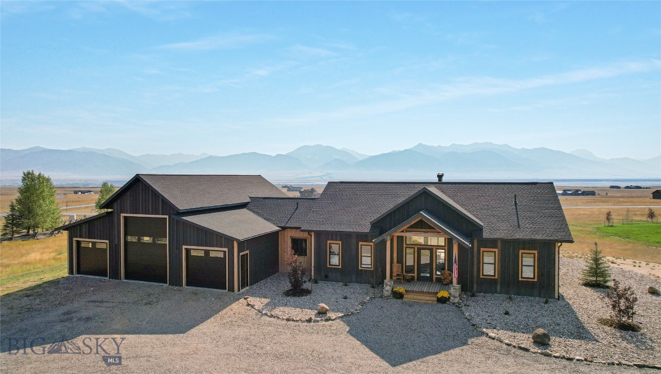 Incredibly unique custom home with 360 degree views of 3 mountain ranges (Madison Mountains, Gravelly Range and Tobacco Root Mountains).  From the moment you step through the formal entry onto the hickory wood floors you are met with cathedral ceilings, open floor plan (living, dining, kitchen) huge windows, unique lighting, and a glimpse of the many artistic touches that will be found through this 4 bed-3.5 bath home.  The kitchen has a large island topped with 3" broken edge leather granite, seeded glass fronted Showcase cabinets, and a big walk-in pantry.  The Dining area has it's own entrance onto the wrap around deck where the outdoor kitchen-BBQ can be found.  The Master Ensuite Bedroom also has it's own entrance onto the deck and the "Wet Room" has a custom shower, 5' soaker tub with a water fall, natural slate flooring and a big walk-in closet.  Custom railing leads to the daylighted-walk out basement where you will find a second wood burning fireplace, 3 more bedrooms, and a kitchenette in the family room (ideal for guests or multi-generational living).  The two basement bathrooms (1 full and 1 three quarter) are each graced with works of tile art as you will see a bear stepping from the Madison River, a Buffalo laying beside Old Faithful, and a moose.  Attached to this incredible house you will find a 3+ bay garage with the middle bay door stretching to 12' wide x 14' high to house your camper/RV.  Besides the 3 bays there are two more rooms - one a "SHOP" for your projects/fly-tying and the second could be the perfect craft room or additional storage.  Artistic placement of the big windows bringing in views, Angela Harris Designer Tile throughout, Bryant Central Heating furnace with fresh air return, superior insulation, On Demand Navien Hotwater Maker, Wireless wall mount internet.....the list goes on and on and on - look in the supplements for the complete list of features.  In Montana  you don't just buy a property - you purchase a new lifestyle......this home and all of it's distinct features will create the haven you are searching for in this sometimes chaotic world.  Come see it today!