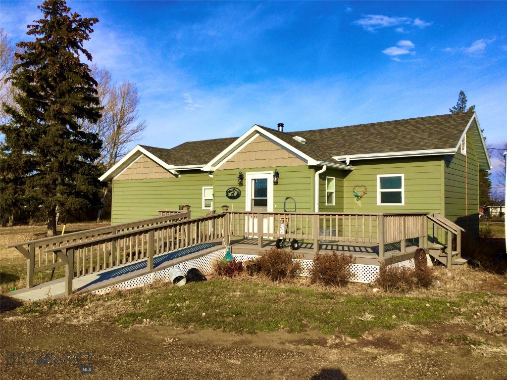 Tucked into the wide-open grain and cattle country of northeastern Montana, this charming 1916 homestead sits on 11 deeded acres at the edge of Scobey with the convenience of city water, sewer, and no HOA telling you what to do with any of it. The 864-square-foot, 2-bed/1-bath home punches above its weight with a freshly updated interior — new kitchen appliances, updated flooring, siding, and roof mean the bones of a century ago are dressed for the next one. Heat up with oil forced air in the winters and cool down with a window unit when the summers roll in warm and golden. For the tinkerer, the collector, or the entrepreneur: three garages and a large shop give you more room to work than most properties twice the price. Scobey itself is a sportsman's paradise — world-class walleye fishing at Fort Peck Lake, trophy big game hunting across vast stretches of public land, and a tight-knit community that still knows how to celebrate with Pioneer Days and county fairs!