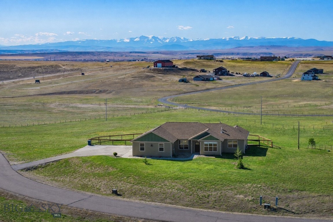 Set against sweeping Big Sky views, this beautifully maintained single-level home in The Village at Elk Ridge offers space, comfort, and a true sense of Montana living. Positioned on 2.3 acres in an elevated position, the property captures expansive mountain, valley, and open land vistas in every direction.  The large lot offers plenty of room or room for you to expand with a shop, greenhouse, or gardens.   

With over 2,000 square feet, the home features a thoughtful floor plan designed for both everyday living and privacy. The spacious primary suite is set apart from the guest bedrooms, creating a quiet retreat, while three additional bedrooms, including a flexible office with closet, provide room for guests, work, or hobbies. The open-concept living area is anchored by a cozy gas fireplace and highlighted by 9-foot ceilings, quality cabinetry, and quartz countertops that bring both style and function to the kitchen.

The home is truly move-in ready with valuable upgrades already in place, including central A/C, a high-quality water treatment system, and a fully landscaped yard with approximately 10,000 square feet of irrigated lawn supported by underground sprinklers.

Located just 35 minutes from Bozeman and within easy reach of Helena and Butte, this property offers convenient access to work and travel while being surrounded by some of Montana’s best recreation; rivers, lakes, and endless outdoor opportunities. Residents of Elk Ridge also enjoy a 6-acre park with sports fields, a basketball court, gazebo, and over 25 acres of shared open space.

A rare combination of views, usability, and value in a growing Three Forks area.