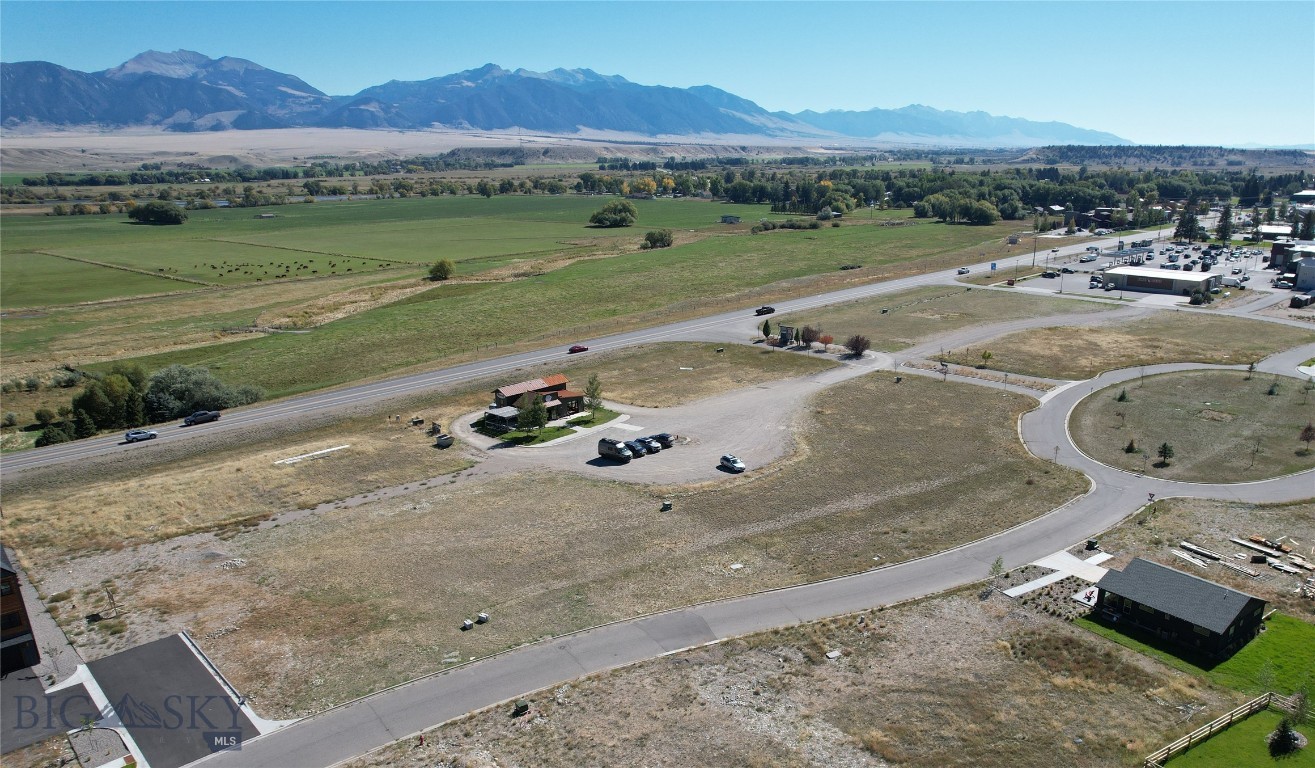 Prime development opportunity and READY TO BUILD!  Offering consists of four, Core Commercial-Residential (C-CR) zoned lots -> Totaling 1.15 hard to find acres in the North Forty subdivision of Ennis, MT.  Tremendous visibility and seamless access to and from MT Highway 287.  DEQ approved as follows: Lot 2 (0.30 ac.) two (2) combination 2-unit residential and 2-unit commercial buildings, Lot 3 (0.34 ac.) two (2) combination 2-unit residential and 2-unit commercial buildings, Lot 4 (0.29 ac.) one (1) 1-unit commercial building and Lot 6 (0.22 ac.) one (1) 1-unit commercial building.  These commercial and potential mixed-use parcels include the convenience of city water and sewer.  Perfectly situated in the heart of the subdivision, with forever views towards the towering Madison Range.  Main St. conveniences, new Madison Foods grocery store, Madison Valley Medical Center, Sure Shot Coffee Co, Ace Hardware, Madison Theatre, and more are all just a short walk from this centrally located blank canvas. The unspoiled western charm of Ennis and countless recreational opportunities bring significant tourism and astounding visitation numbers throughout the year.  Bozeman, Big Sky Resort and Yellowstone NP are each an hour drive +/-.  Endless options for this best-in-class location -- in a blossoming area of town.  One of the most desirable development opportunities in the greater Rocky Mountain West.