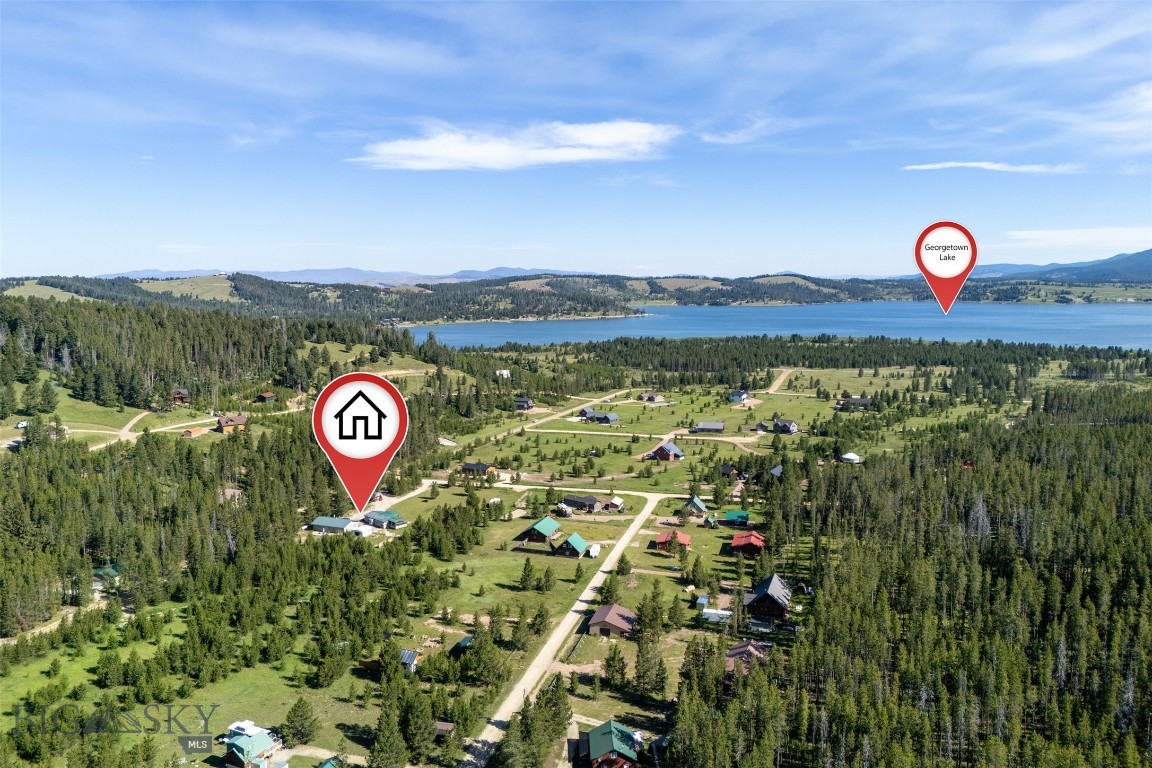 Don’t miss this rare opportunity to own a versatile, income-producing property situated on two prime lots near Georgetown Lake. Whether you’re looking to expand your rental portfolio, create the perfect multi-generational living setup, or enjoy a mountain retreat with room for everyone, this property offers exceptional flexibility and value.

The main residence features three spacious bedrooms and two full baths, all conveniently located on one level for comfortable everyday living. In addition, the property includes a super cute one-bedroom apartment attached to the garage, ideal for long-term rental income, short-term vacation guests, a private mother-in-law suite, or separate living quarters for extended family. 

Live in one residence while renting the others to help offset expenses, or utilize the entire property as a private family compound with multiple independent living spaces. The layout and setup provide endless potential for investors, vacation homeowners, or buyers seeking flexible living arrangements.

Enjoy all the recreation and adventure this sought-after area has to offer, including nearby Georgetown Lake, Echo Lake, Discovery Ski Area, blue-ribbon fishing, snowmobiling, hiking, and access to thousands of acres of Forest Service land.