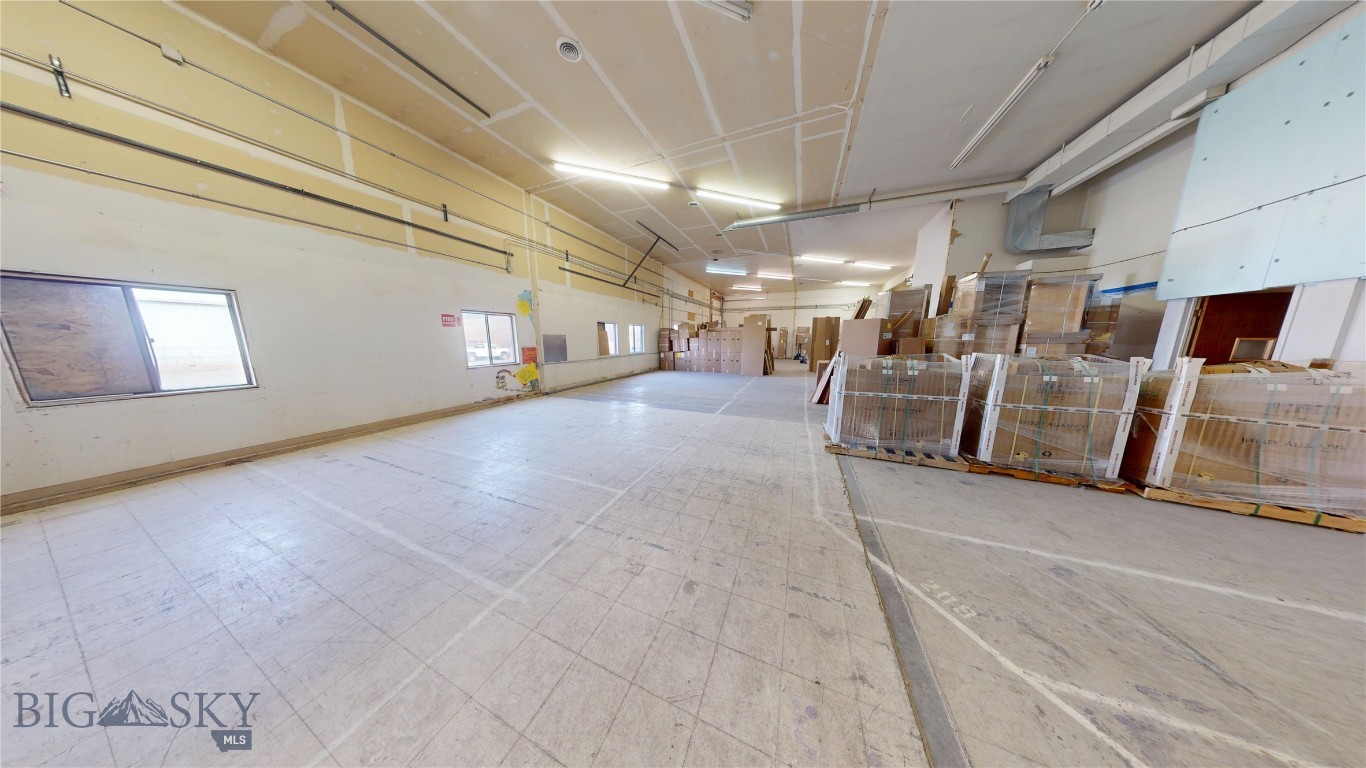 Large warehouse/office building in convenient location just off Griffin Drive.  The building layout is a combination +/-6,000 SF of warehouse space on the main level, primarily open with high ceilings, a grade level overhead door, as well as a loading dock, and several man doors.  There is also +/-2,000 SF of office on the main level.  The office space has a showroom area, three offices, a conference room and a kitchenette.  The second floor is an additional +/-2,000 SF of nice office space with six offices, a conference room and kitchenette.  Due to the location of entrances, restrooms, and layout this building could be easily demised into a multitude of different options beyond one end user.  The .704 acre lot allows for extra space for truck parking, yard space, etc.  Worth taking a look at this property to envision the possibilities!