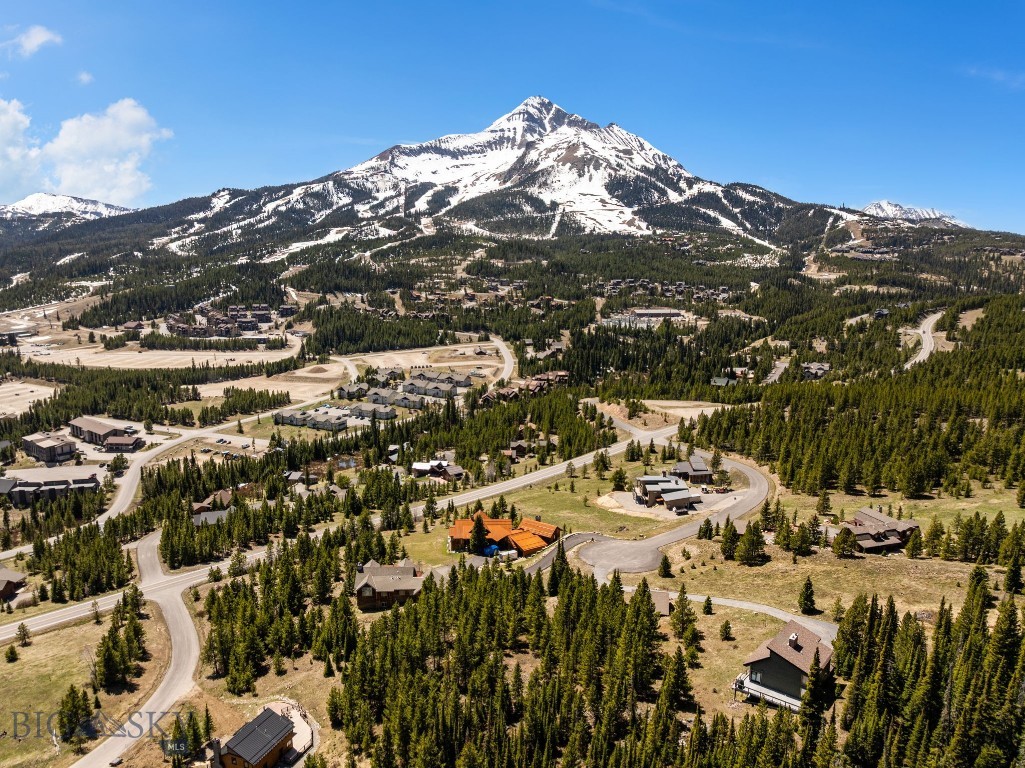 Nestled at the end of a quiet and private cul-de-sac in Big Sky’s Cascade Subdivision, this exceptional homesite offers a rare combination of convenience, privacy, and breathtaking mountain scenery. The lot features gentle topography, providing an ideal and highly usable build site for your future mountain retreat.

Mature trees have been thoughtfully left in place, allowing a future owner the flexibility to selectively thin and shape the landscape to suit their desired level of privacy while maximizing surrounding viewsheds. Stunning views of Lone Mountain take center stage, complemented by expansive down-valley vistas that capture the beauty of Big Sky in every direction.

Located just a short walk from the White Otter 2 and Cascade 3 ski lifts, this property offers outstanding access to world-class skiing while maintaining a peaceful and secluded setting. A truly special opportunity to create a custom mountain home in one of Big Sky’s most sought-after locations.